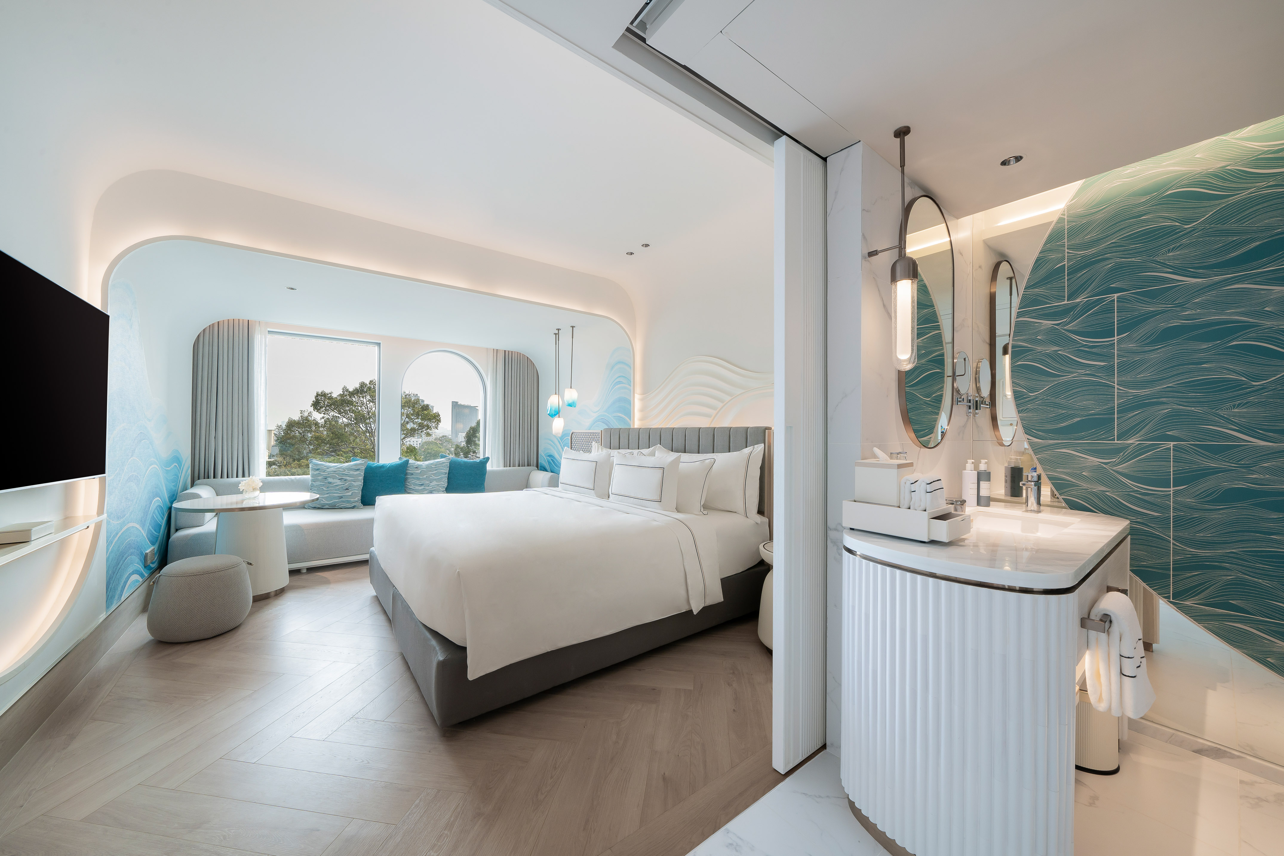 a room with a bed and a sink