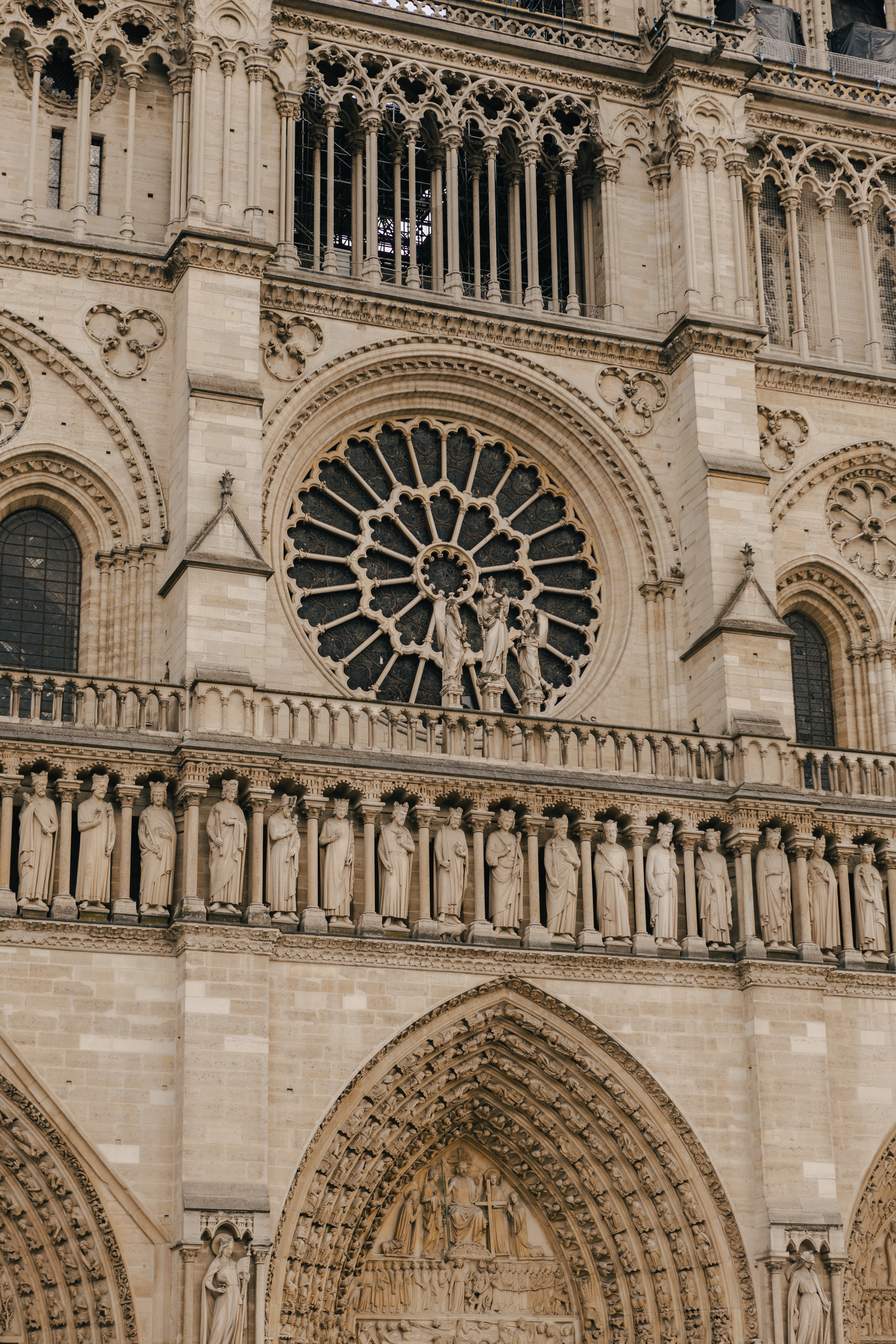 a large stone building with statues on the side