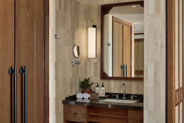 a bathroom with a mirror and sink