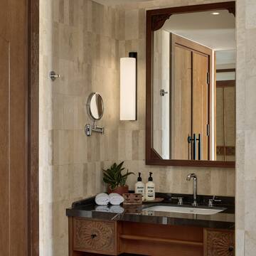 a bathroom with a mirror and sink