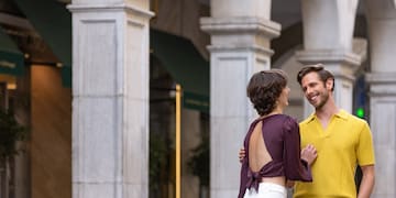 a man and woman standing outside