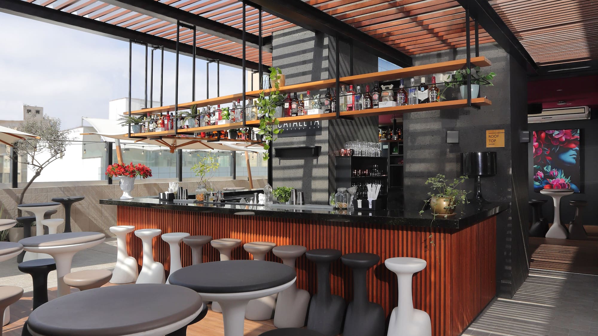 a room with tables and stools