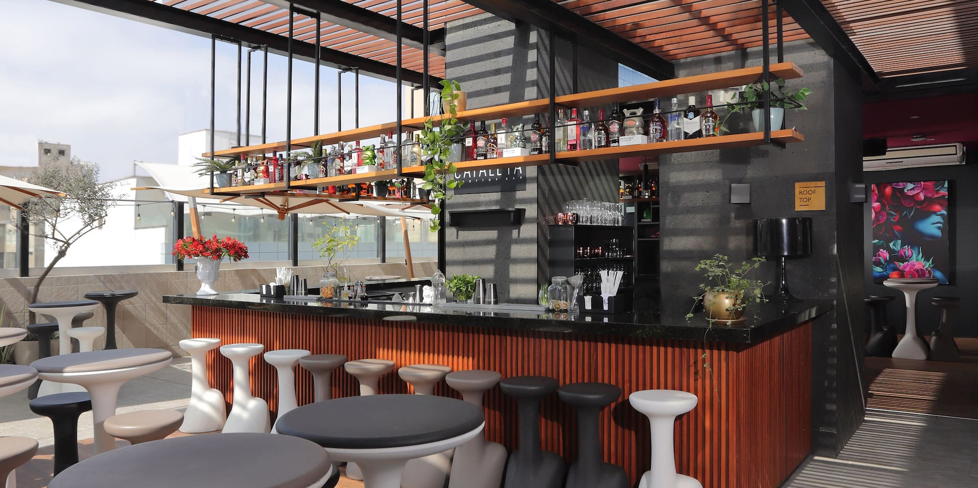 a room with tables and stools