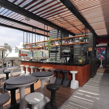 a room with tables and stools