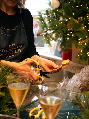 a person cutting a piece of fruit