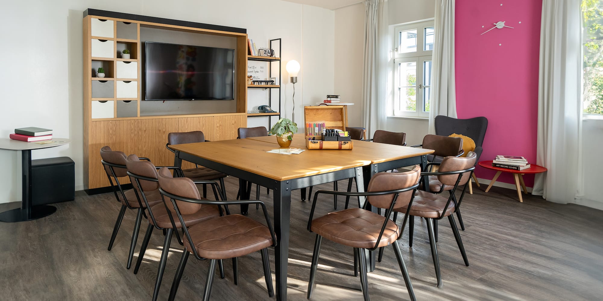 a room with a table and chairs