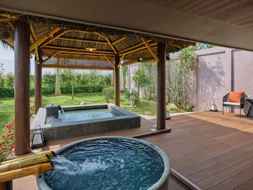 a hot tub and a wooden deck