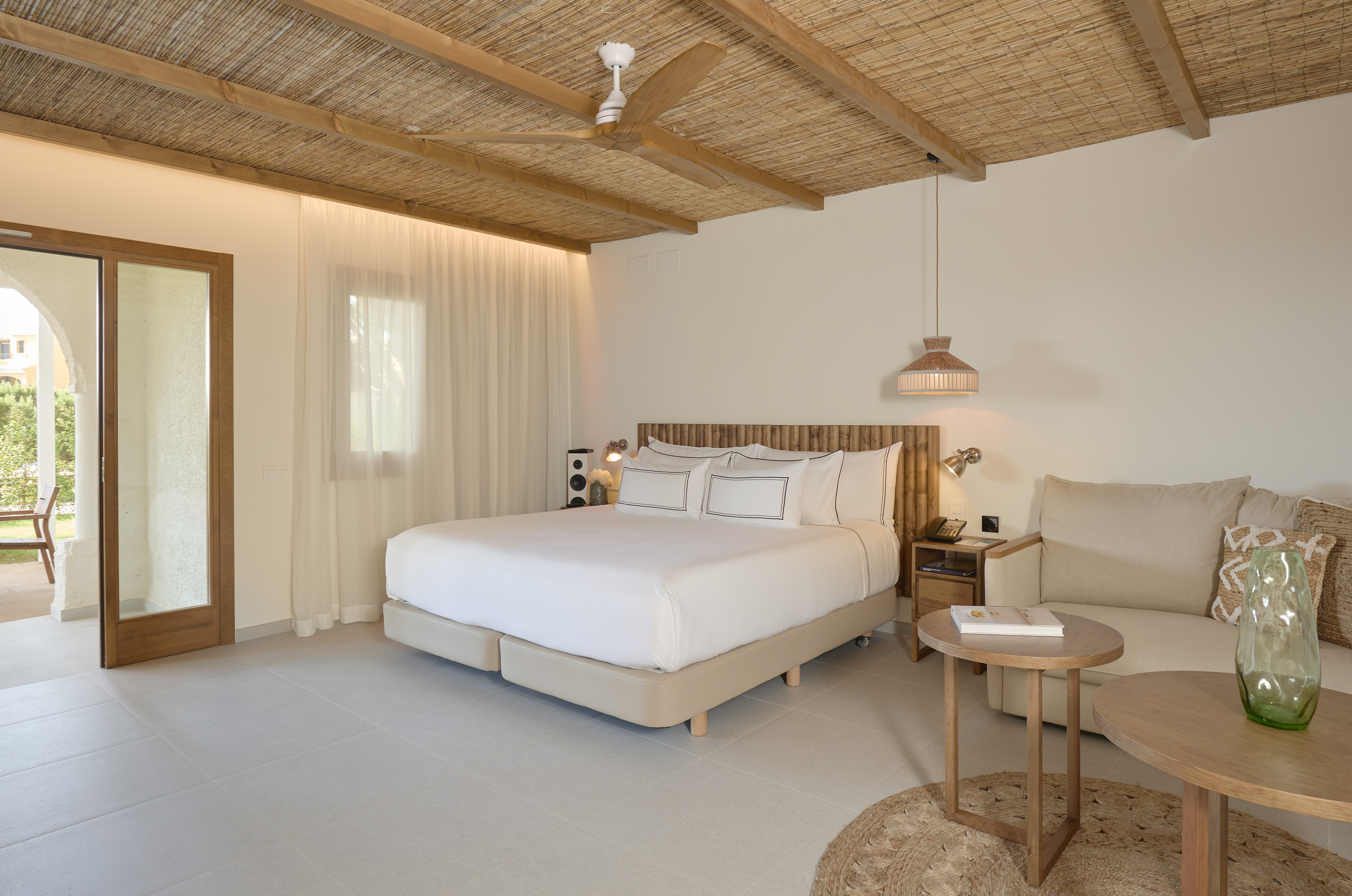 a bedroom with a bed and a chair