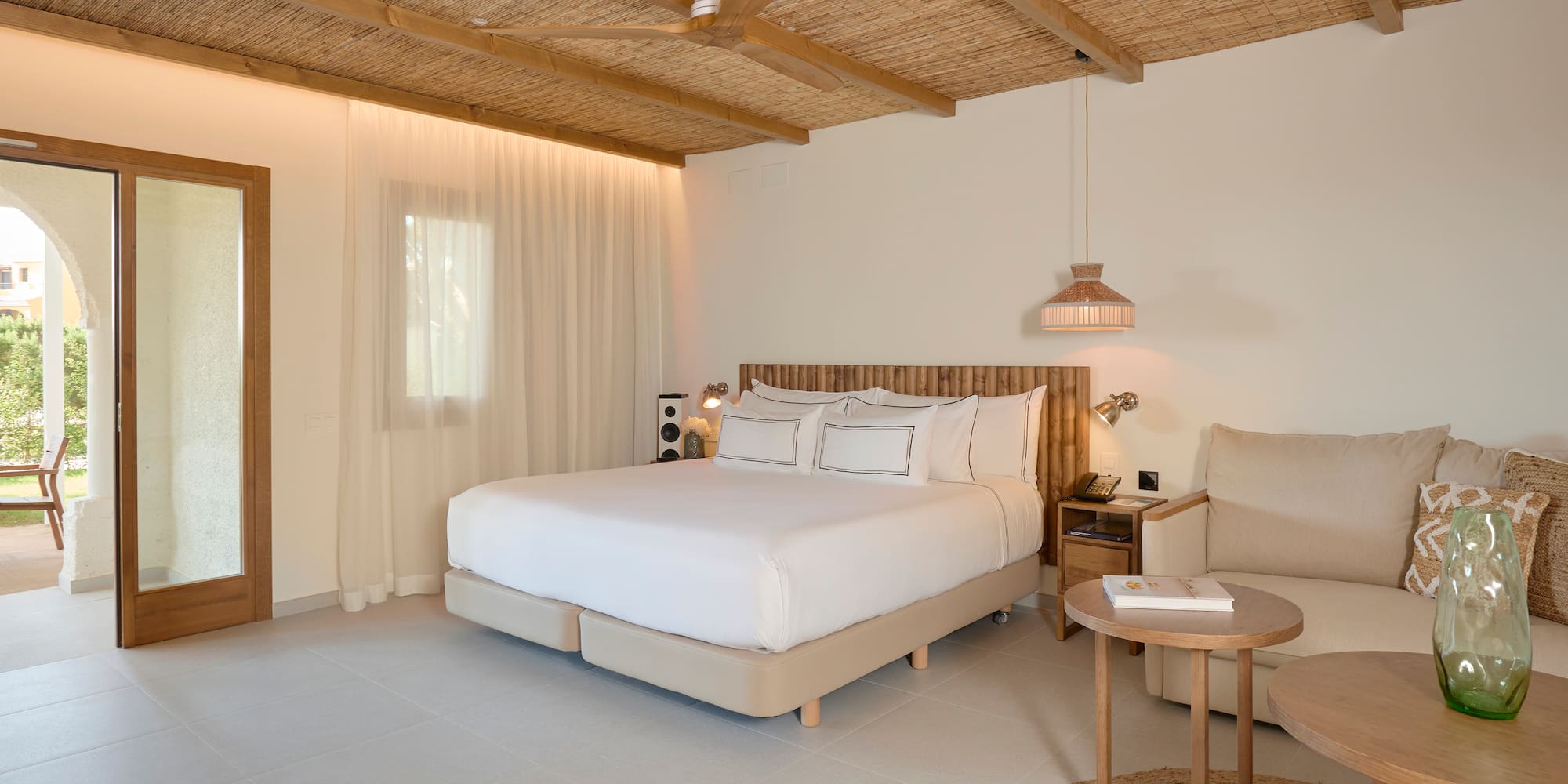 a bedroom with a bed and a chair