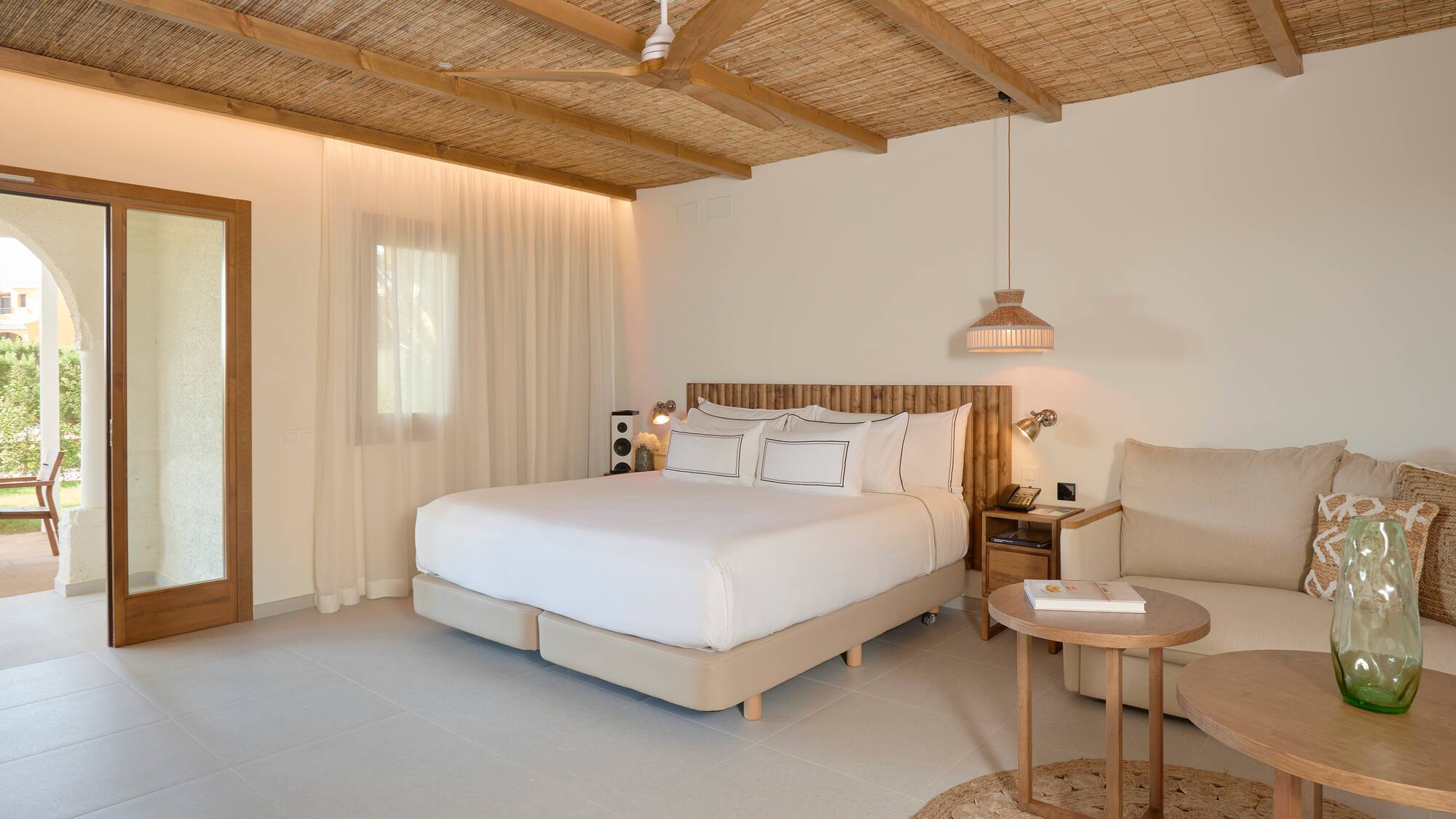 a bedroom with a bed and a chair