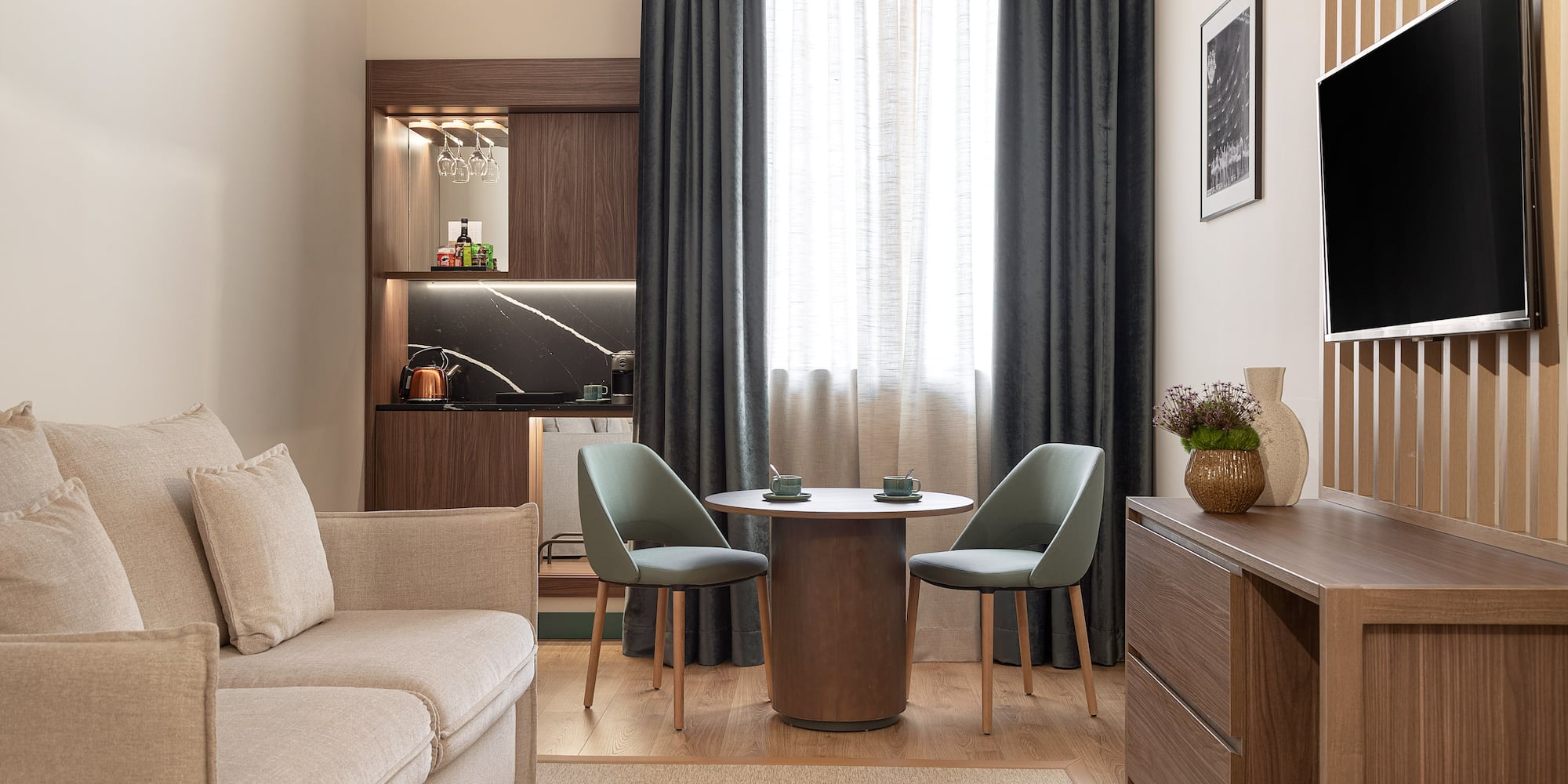 a living room with a table and chairs