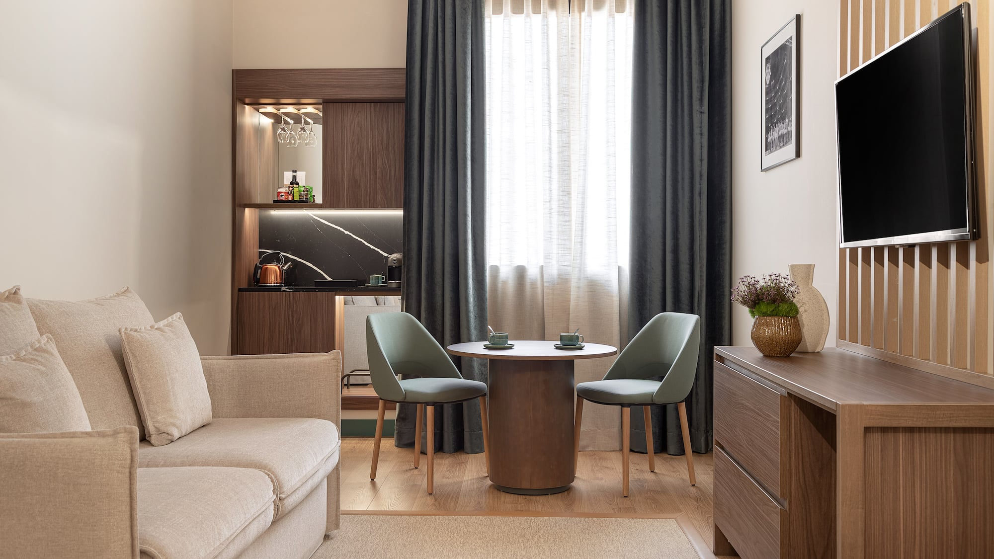 a living room with a table and chairs