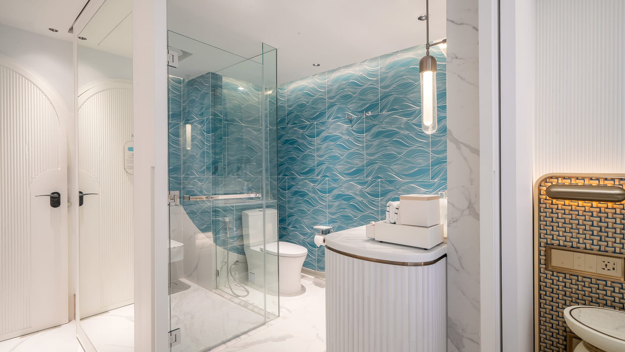 a bathroom with a blue wall and a toilet