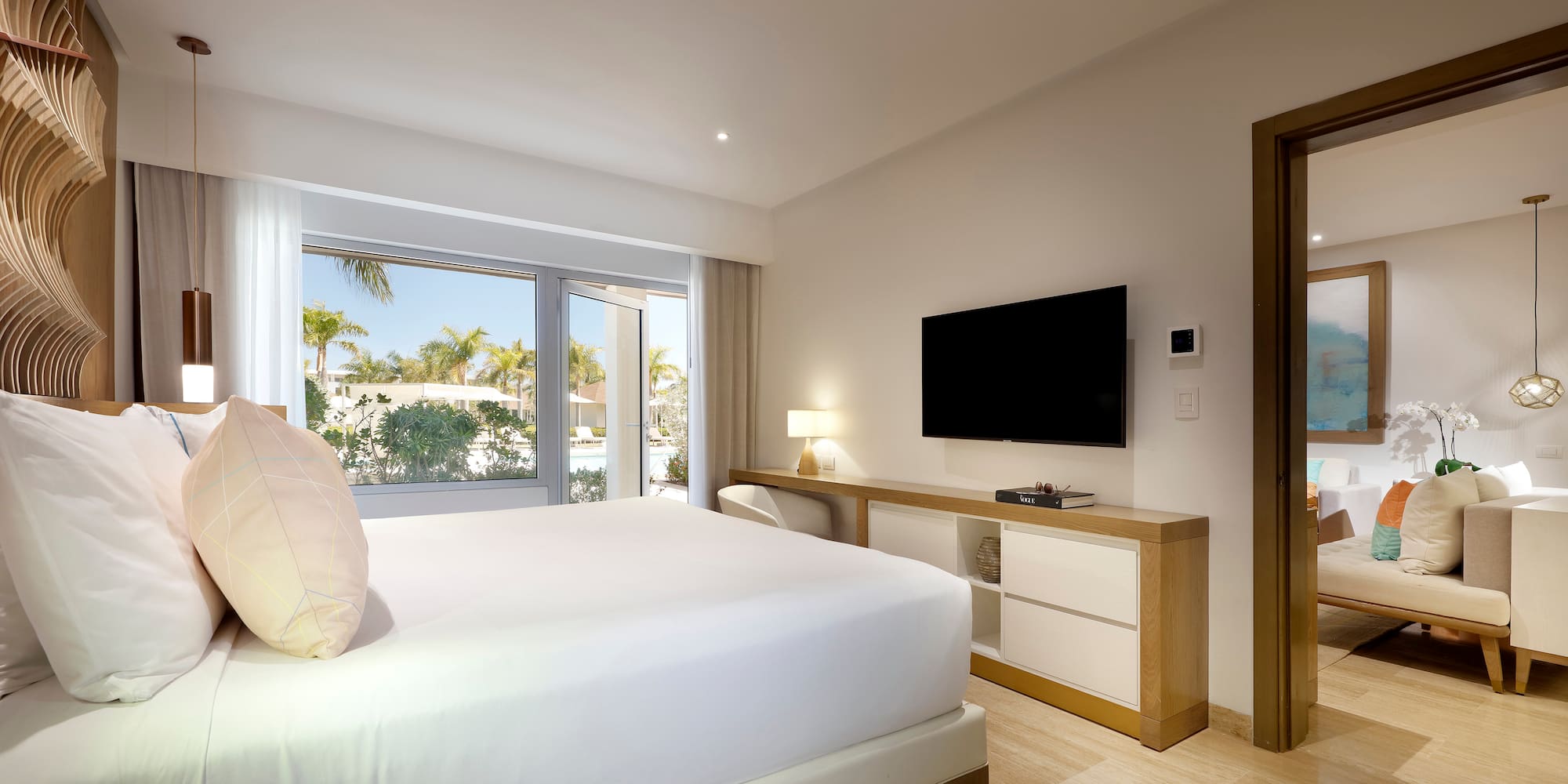 a bedroom with a television and a bed