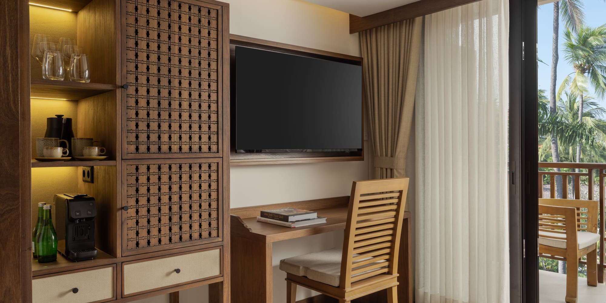 a room with a tv and a cabinet