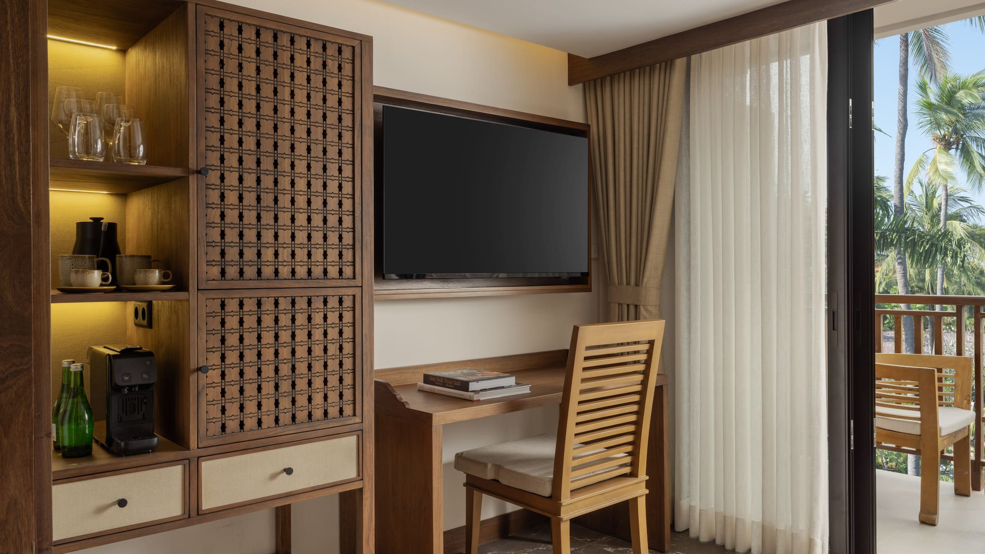 a room with a tv and a cabinet