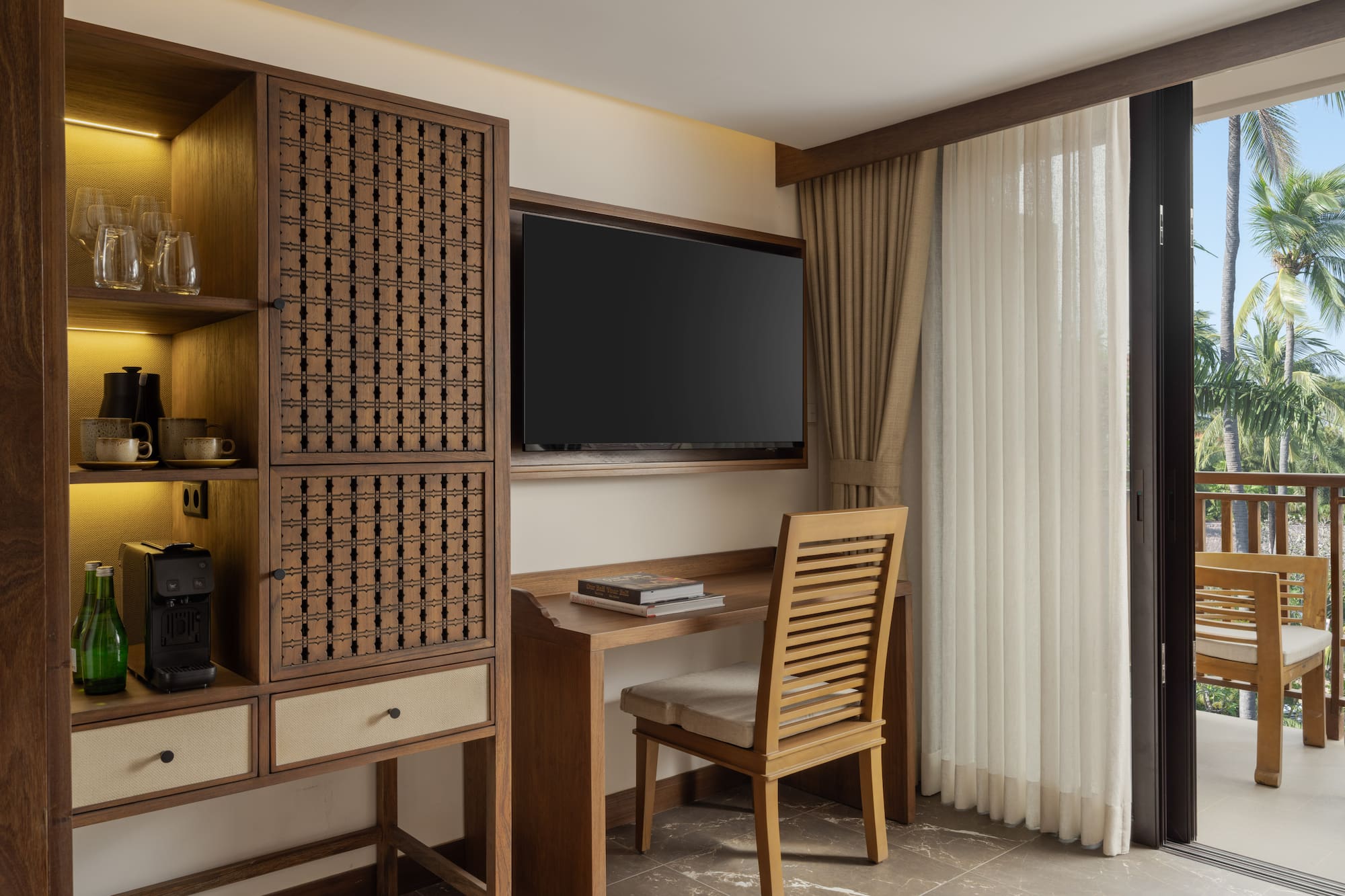 a room with a tv and a cabinet