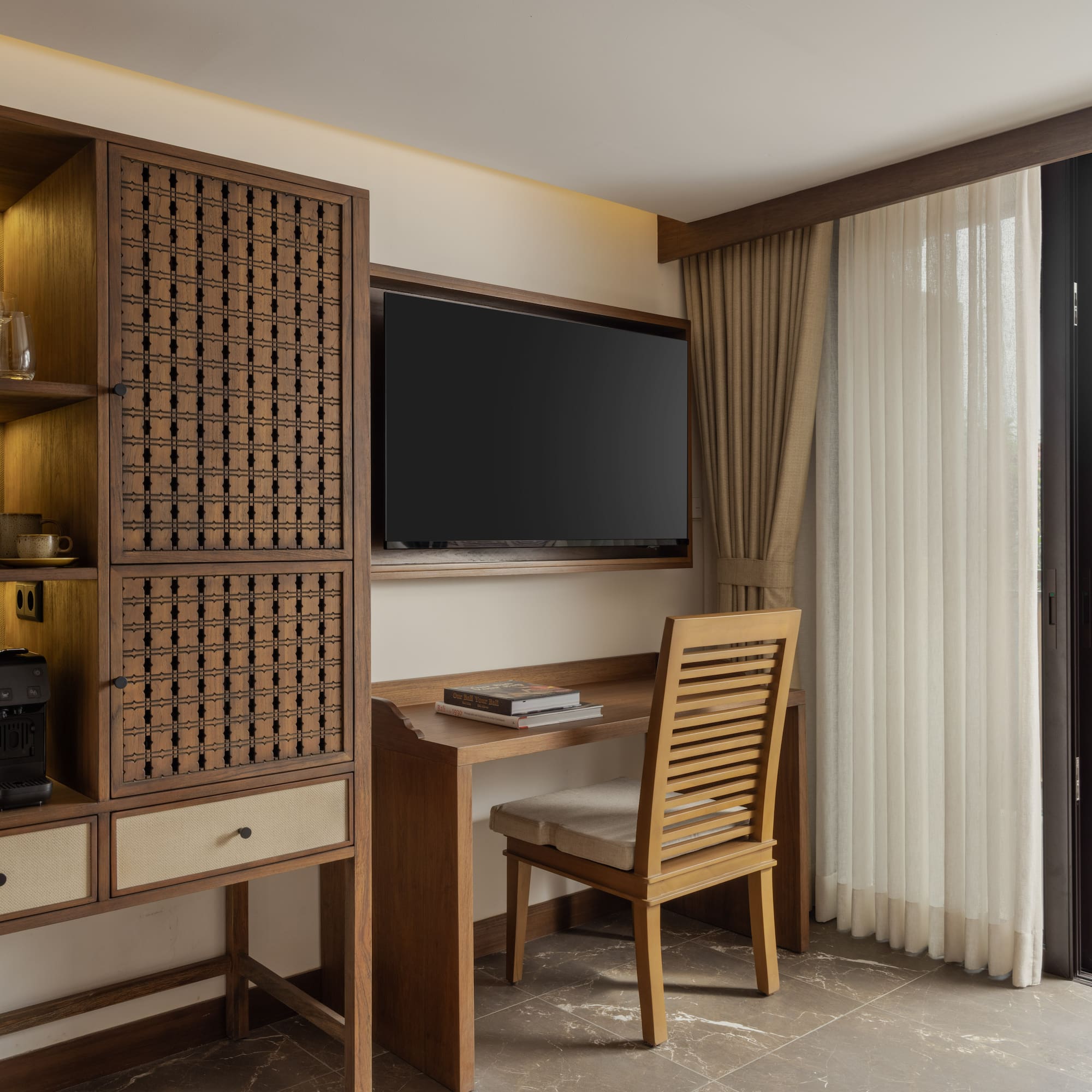 a room with a tv and a cabinet