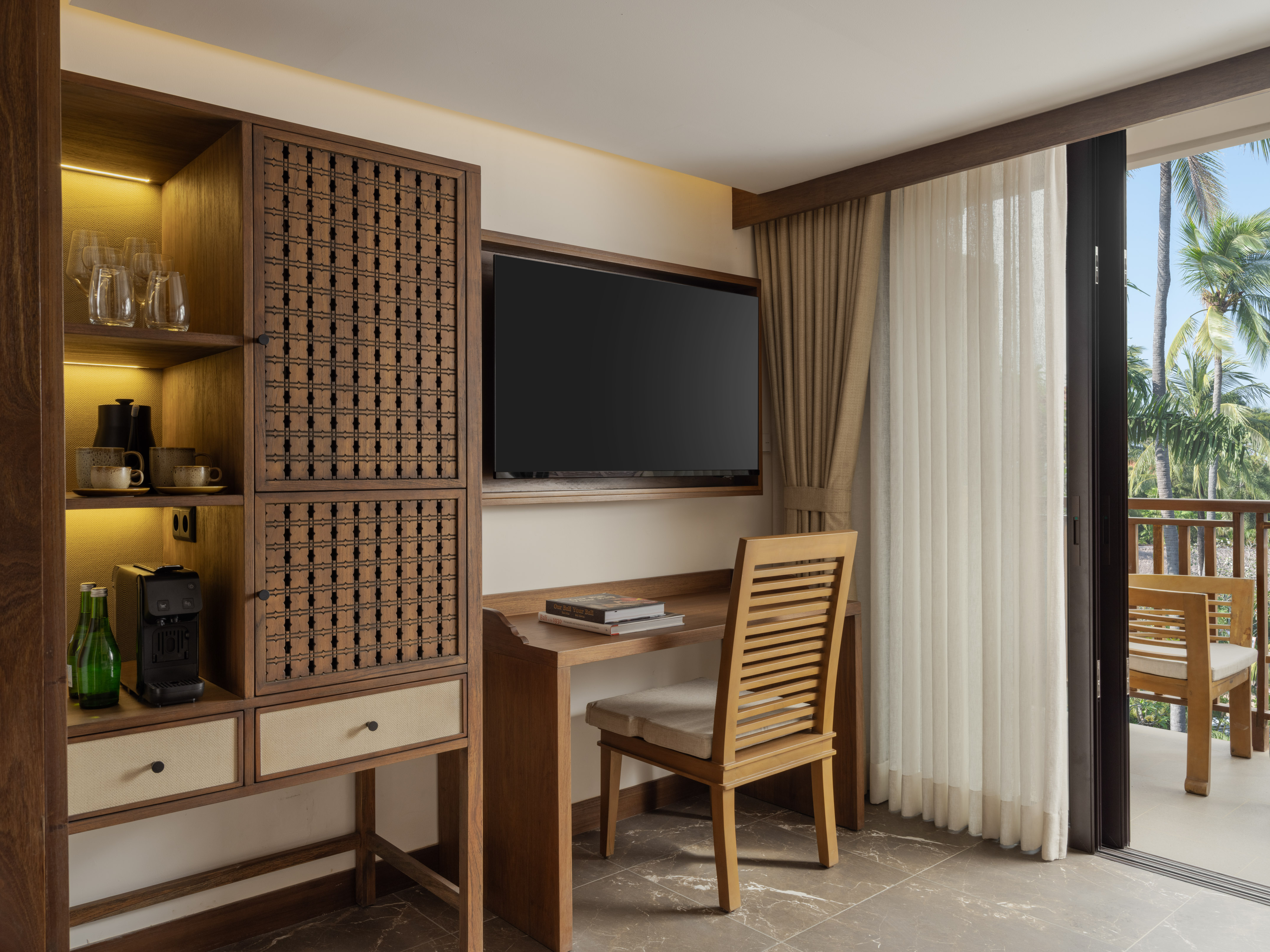 a room with a tv and a cabinet