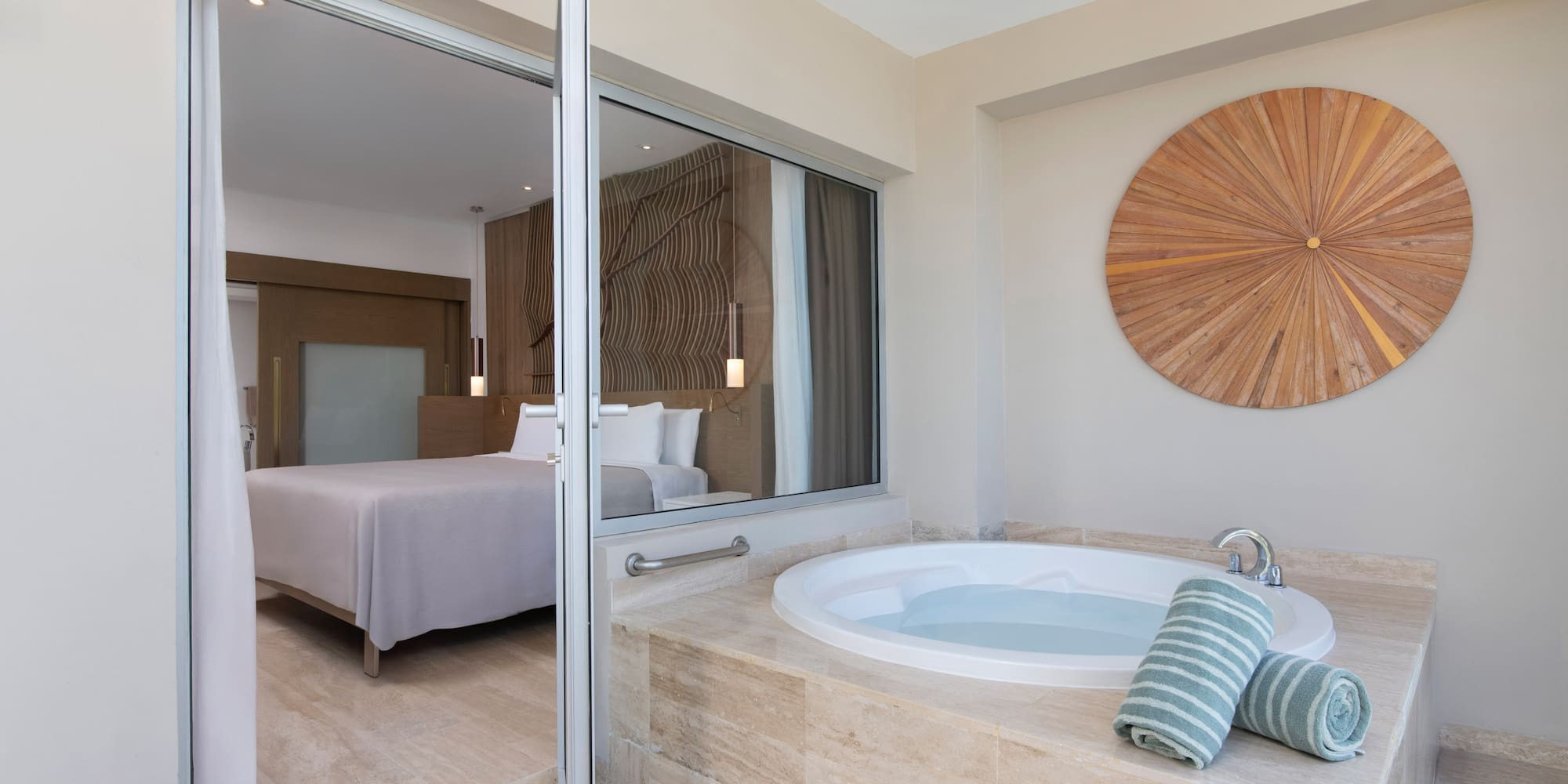 a bathroom with a jacuzzi tub and a bed