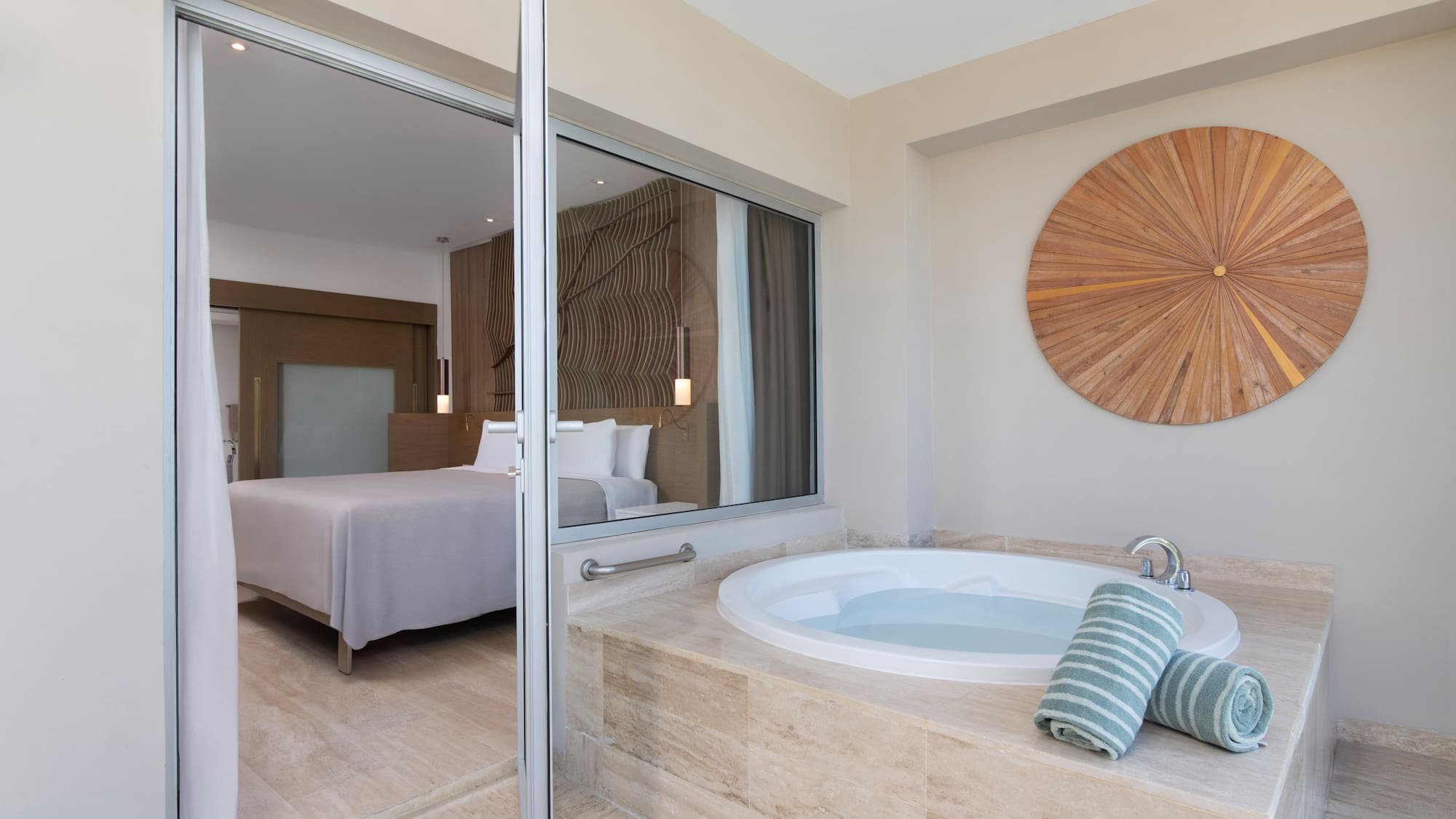 a bathroom with a jacuzzi tub and a bed