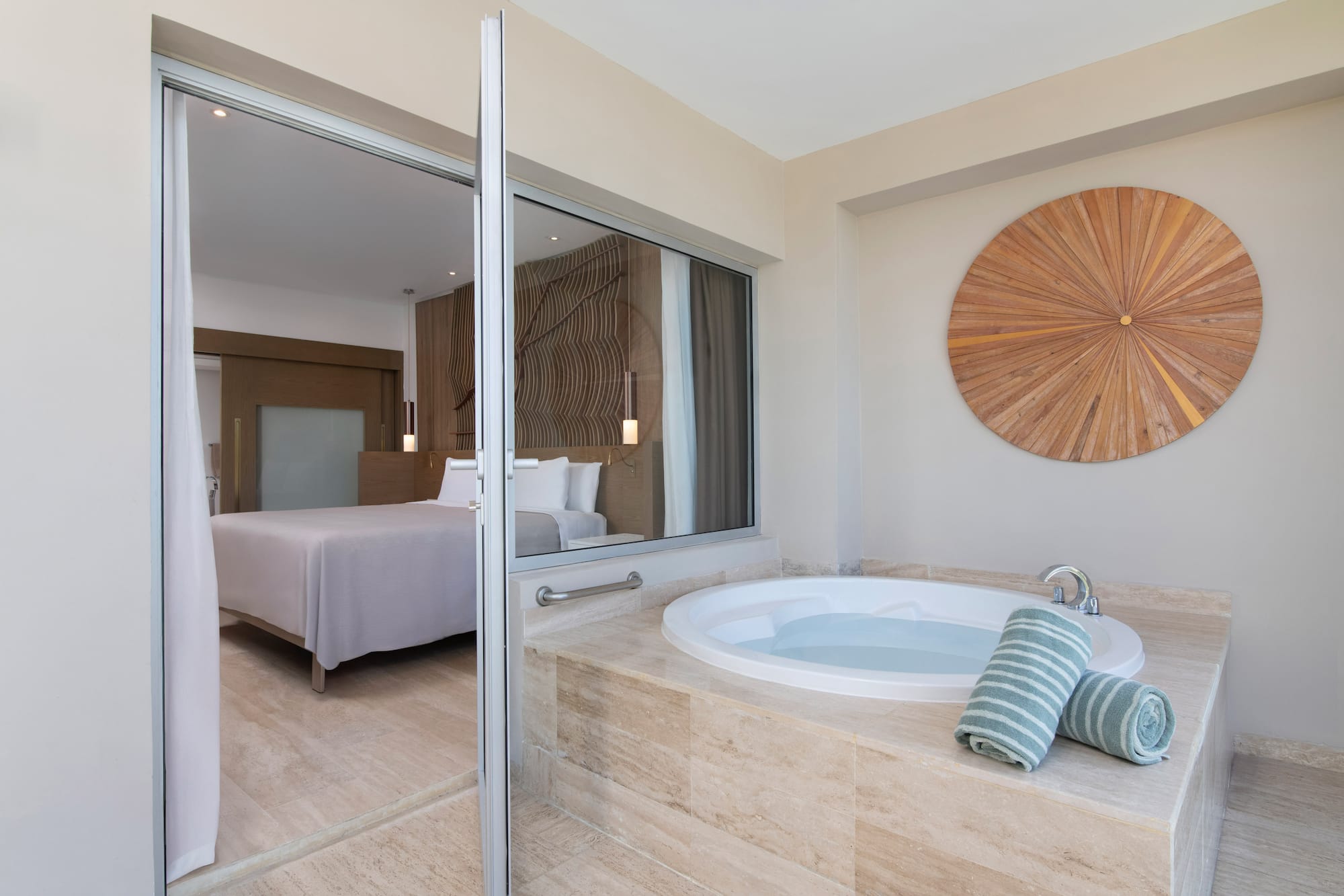 a bathroom with a jacuzzi tub and a bed