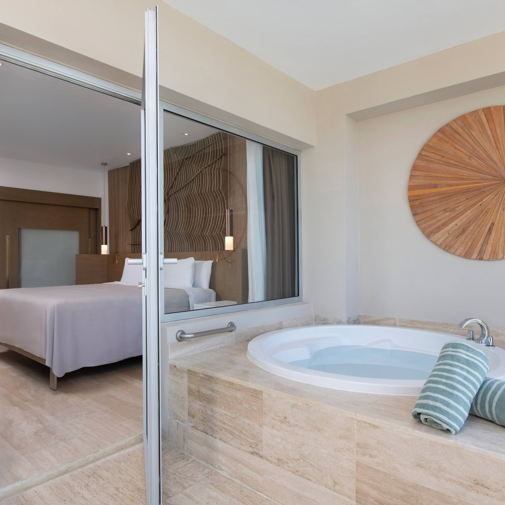 a bathroom with a jacuzzi tub and a bed