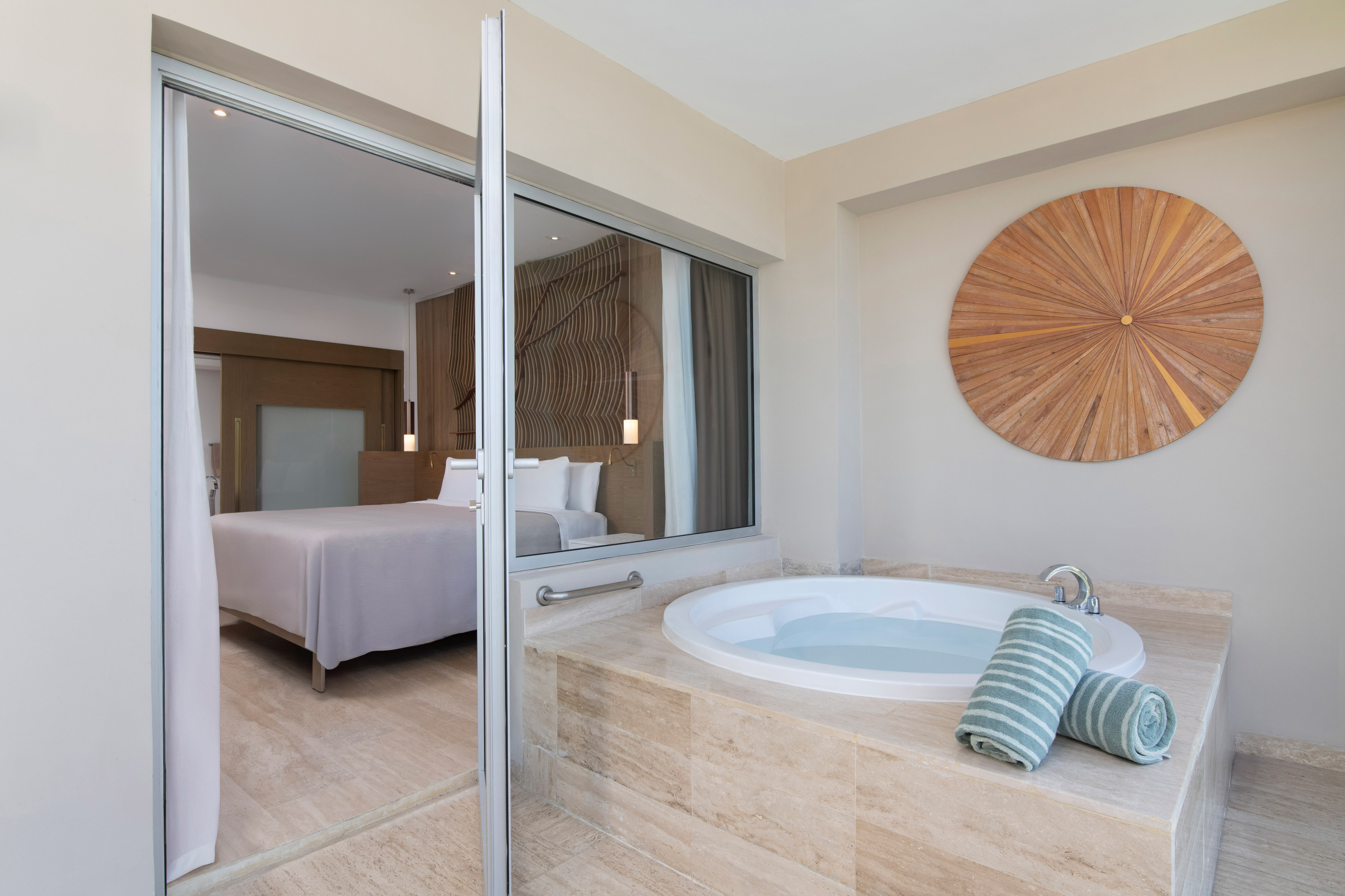 a bathroom with a jacuzzi tub and a bed