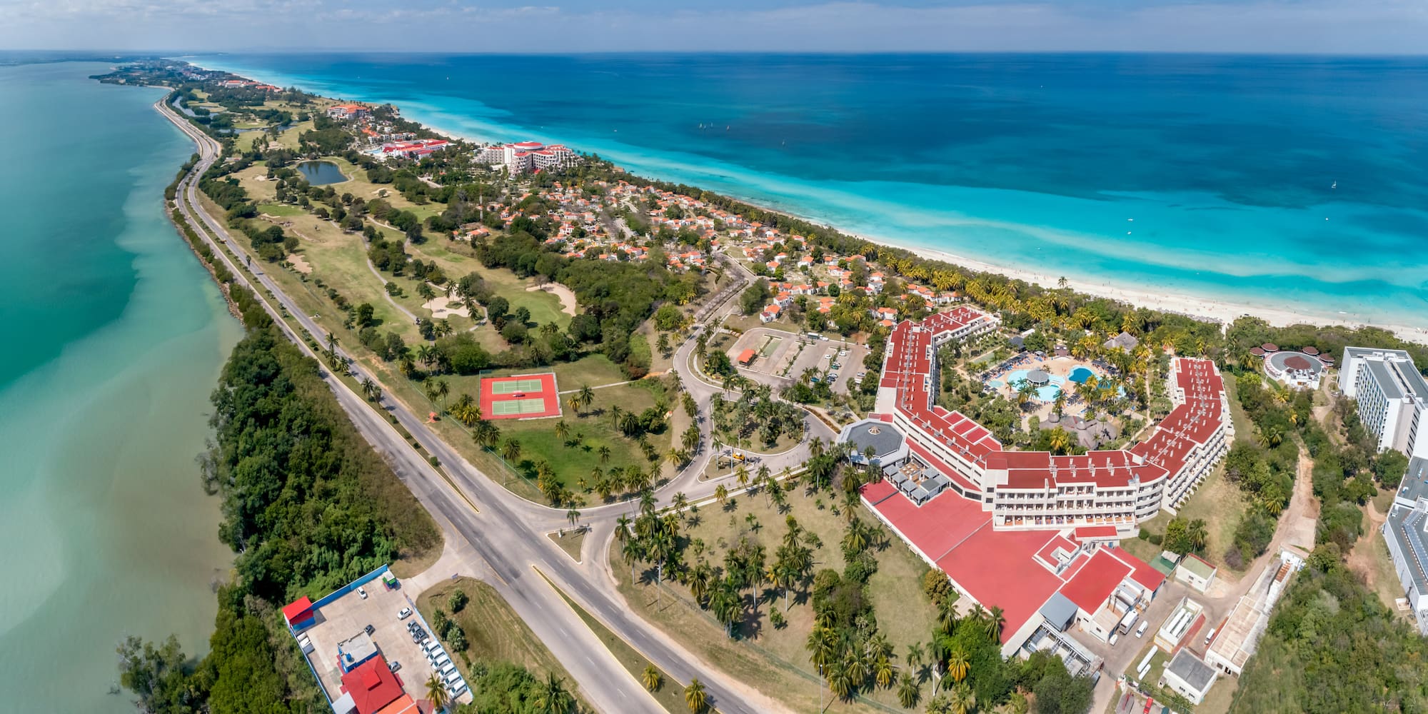 a large building next to a beach