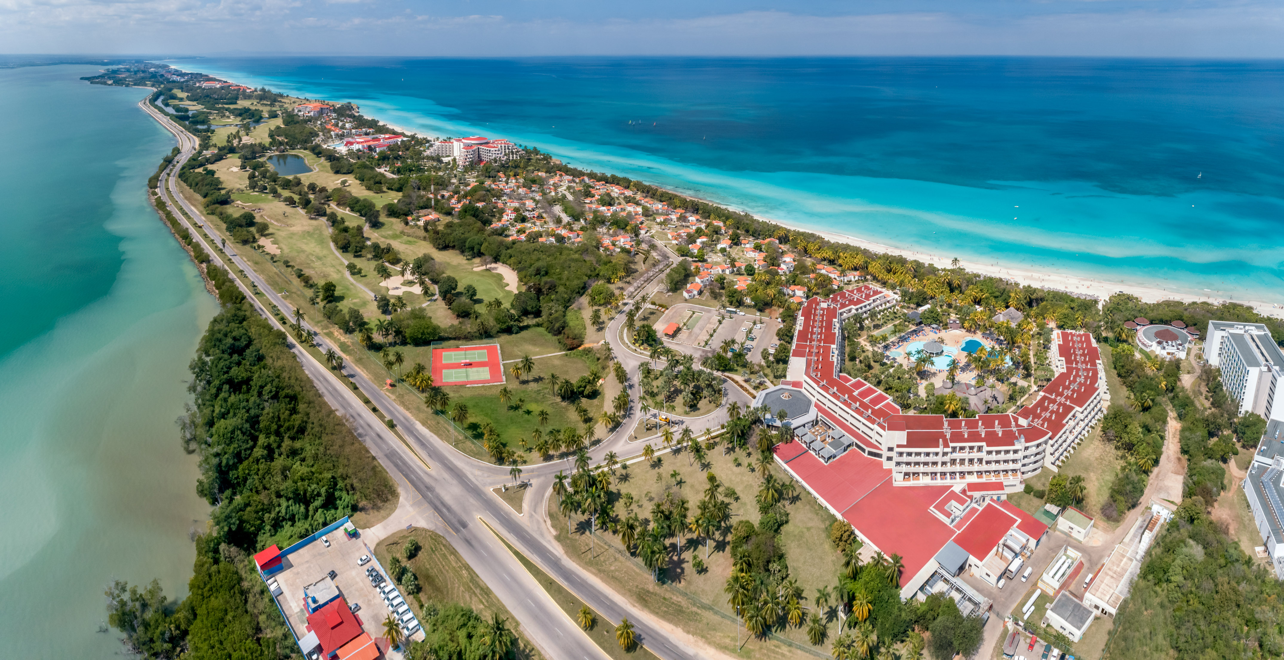 a large building next to a beach