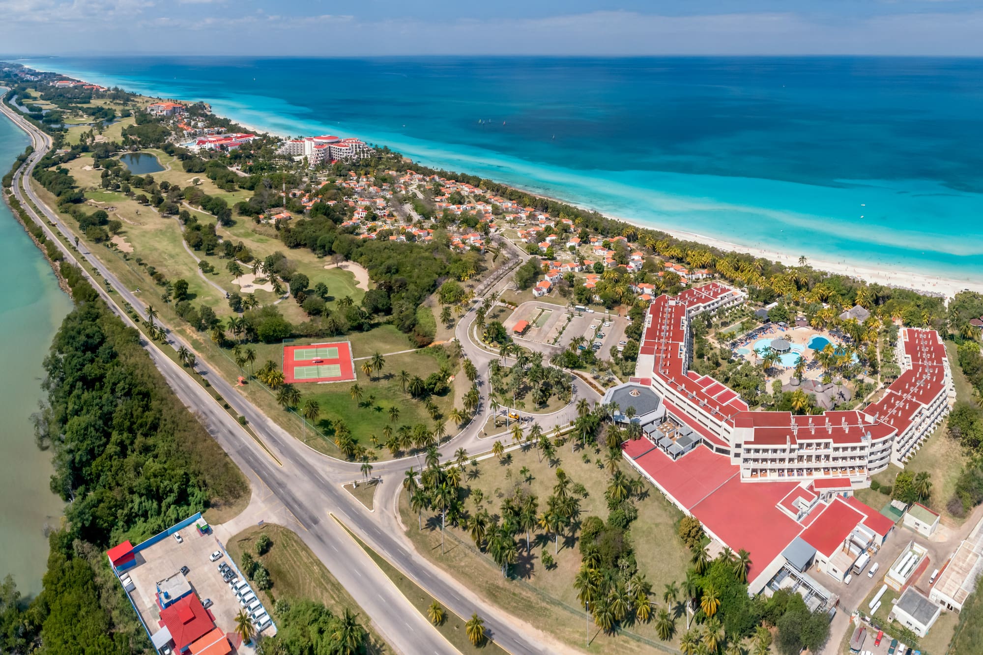 a large building next to a beach