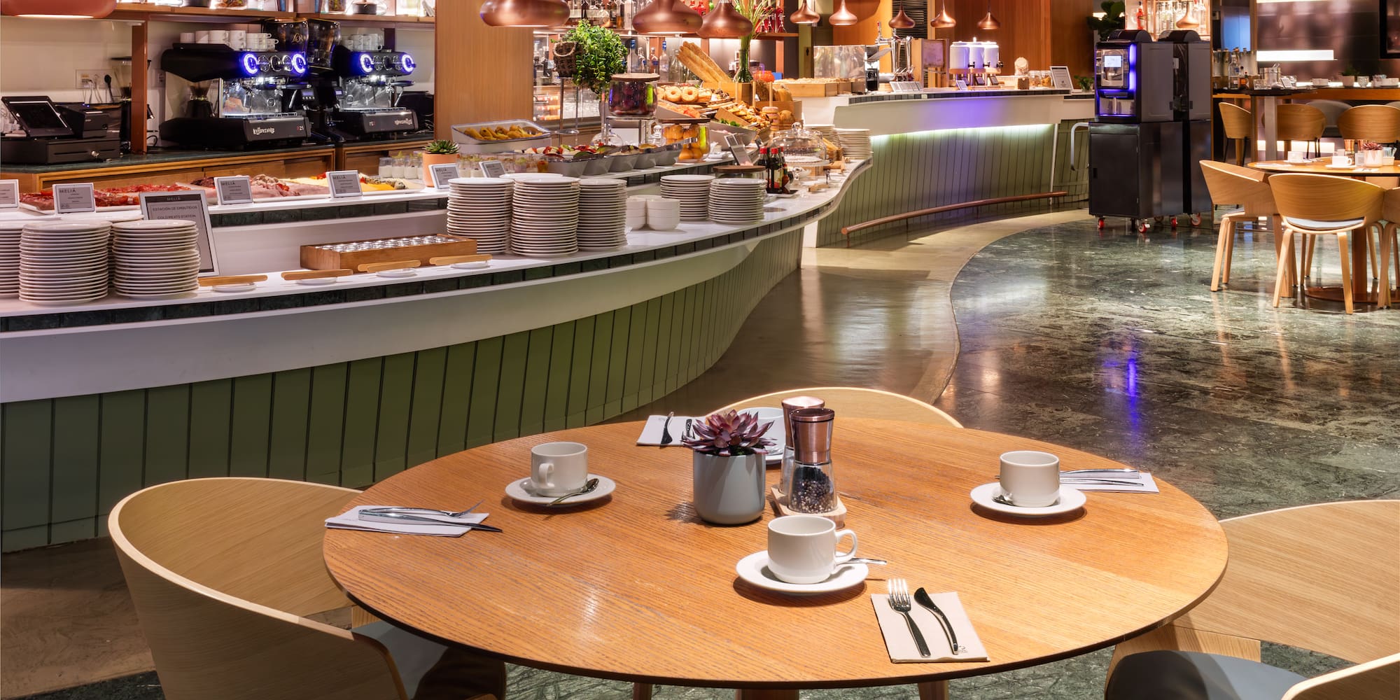 a restaurant with a counter and tables