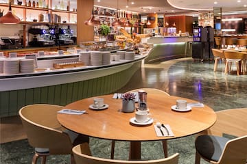 a restaurant with a counter and tables