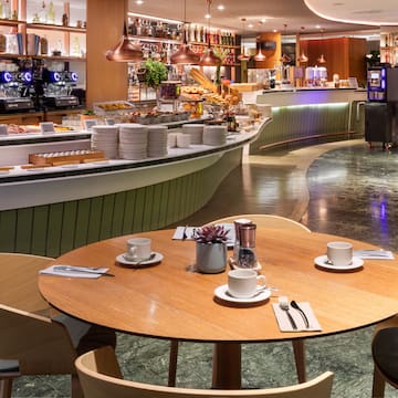 a restaurant with a counter and tables