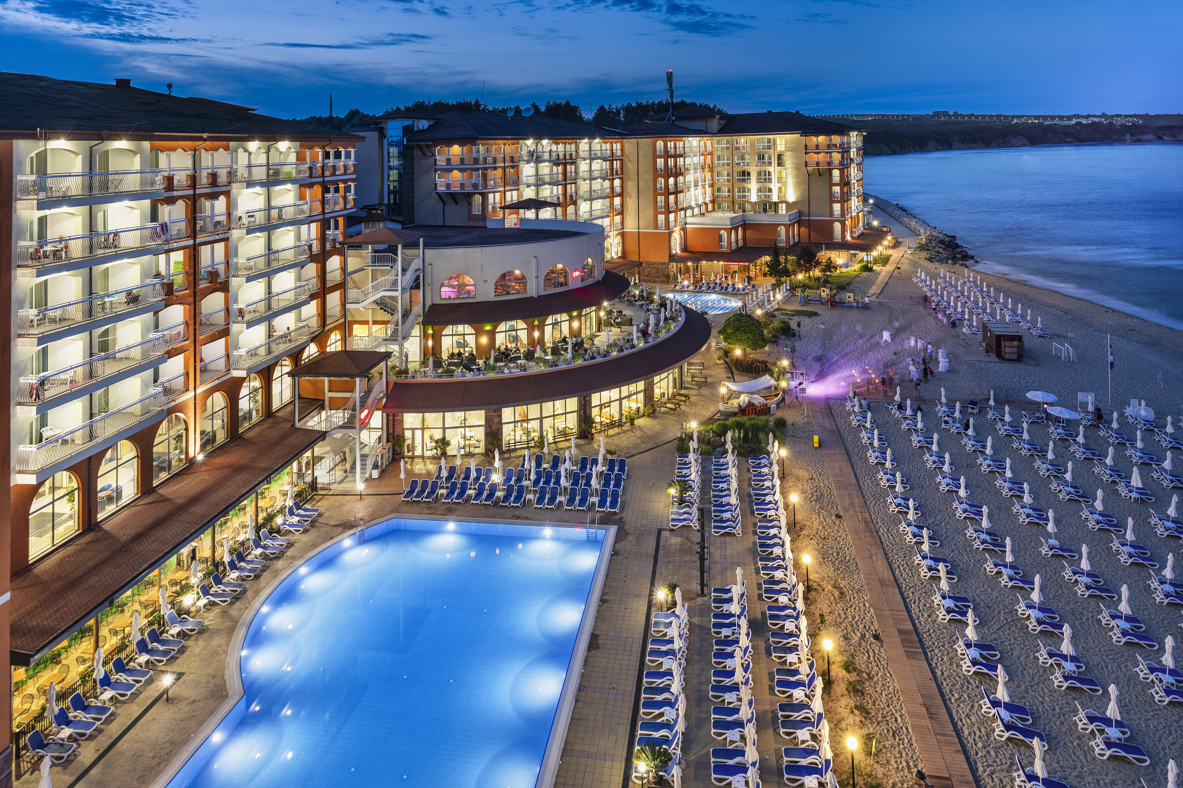 a hotel with a pool and beach