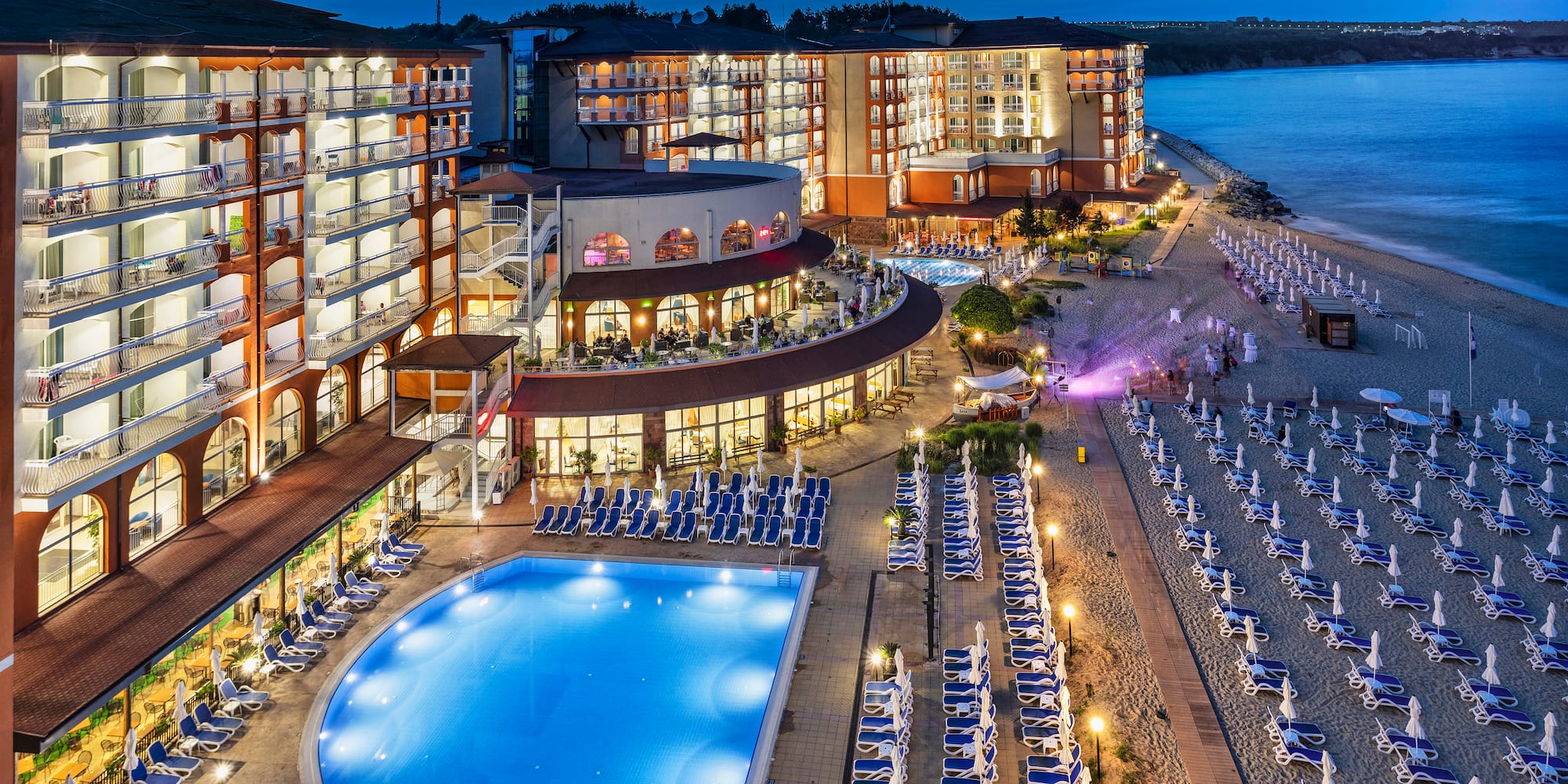a hotel with a pool and beach