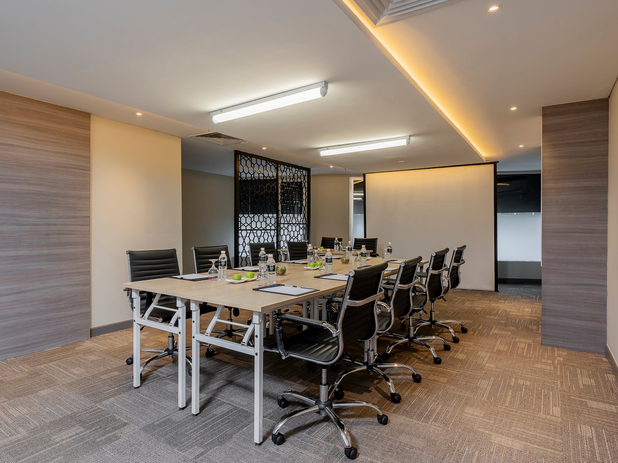 a conference room with a table and chairs