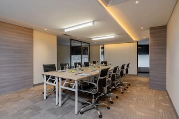 a conference room with a table and chairs