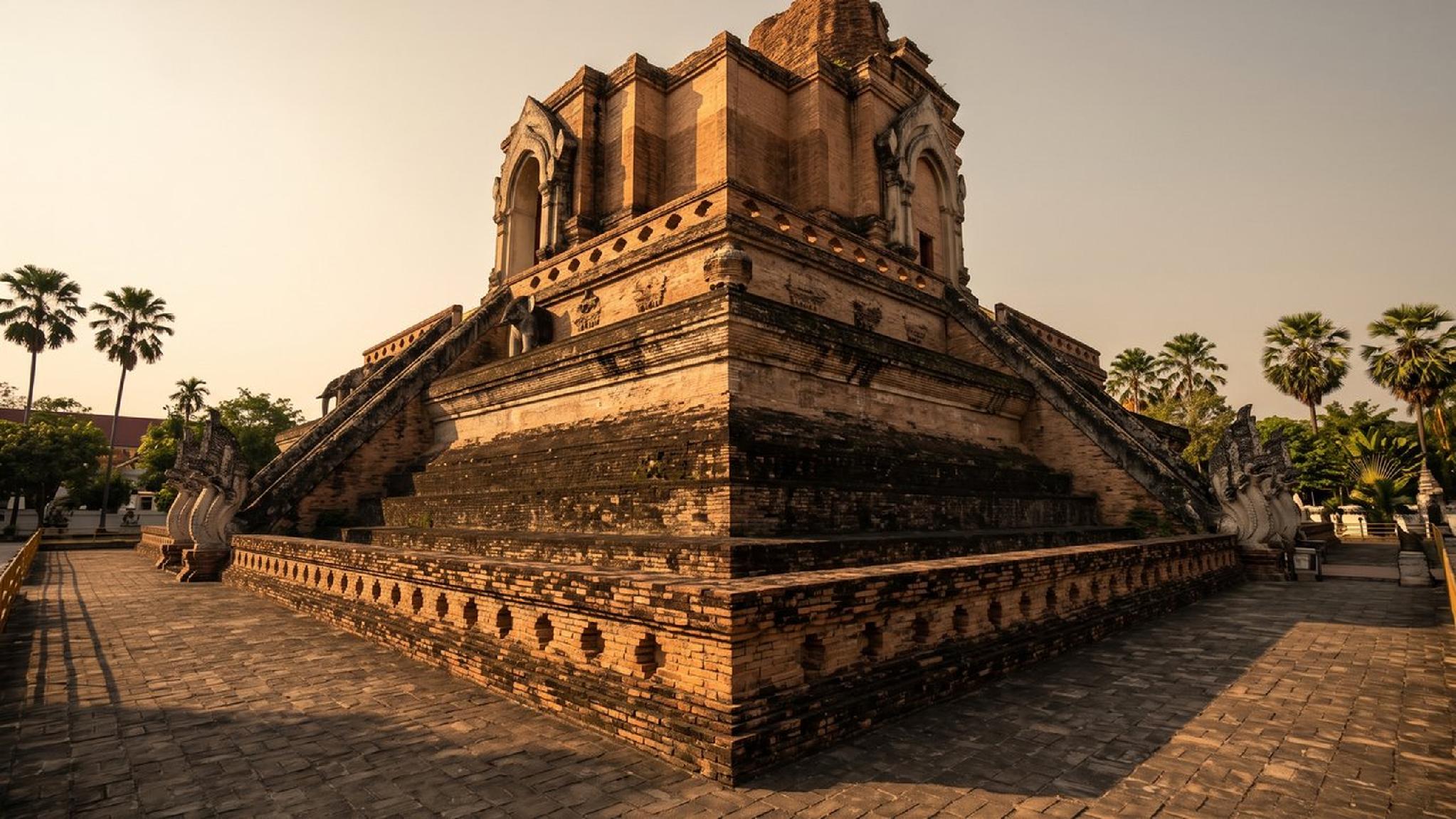 Ancient tiered brick temple with Naga stairs in Chiang Mai, Thailand.