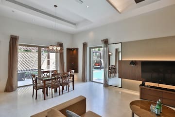 a room with a table and chairs