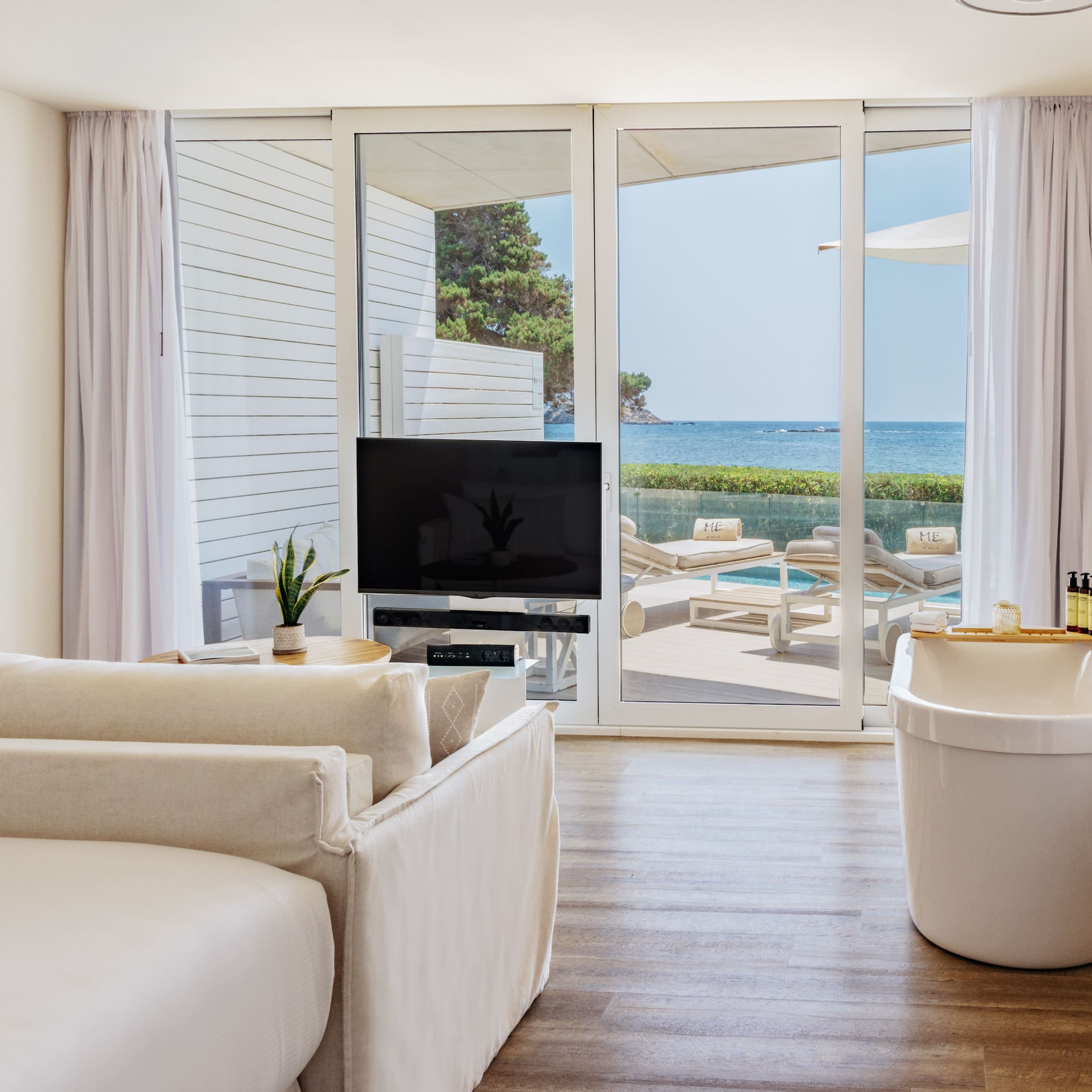 a room with a television and tub