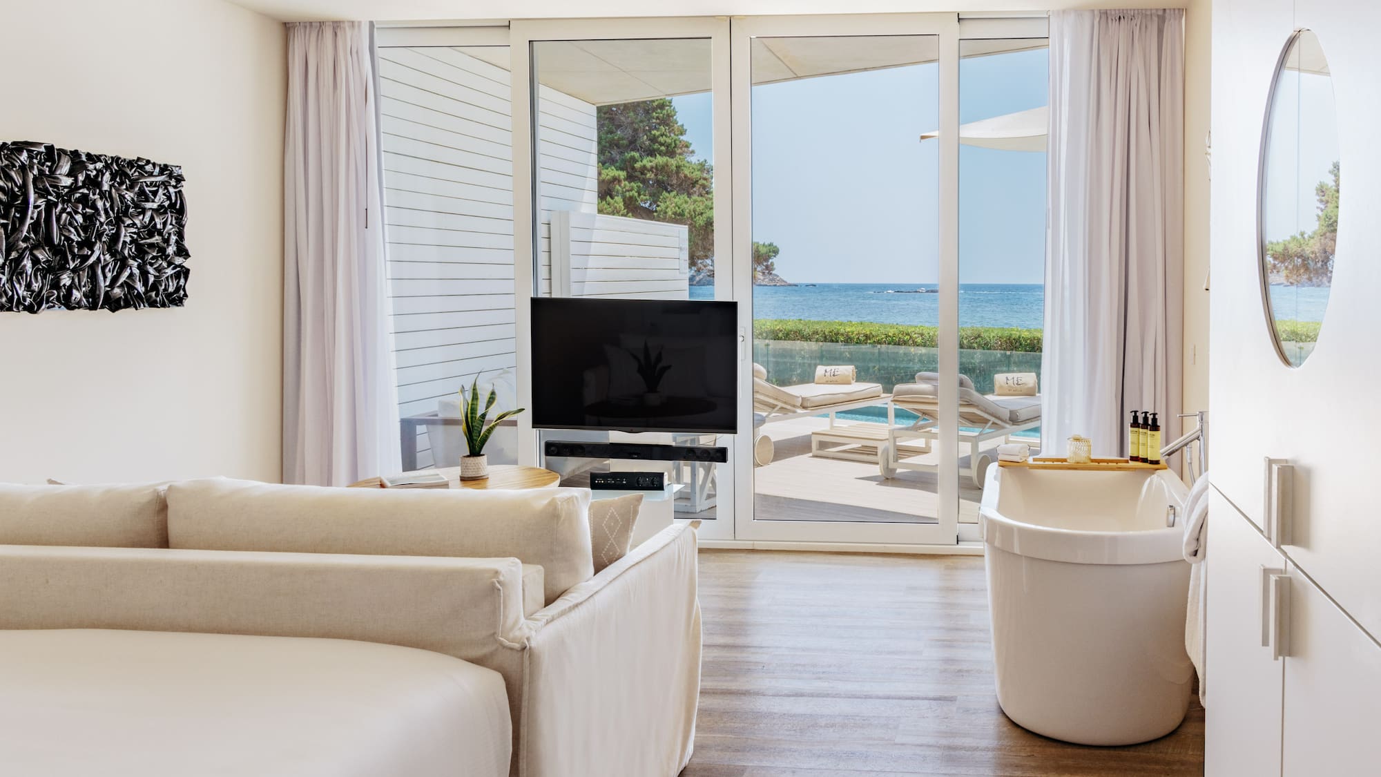 a room with a television and tub