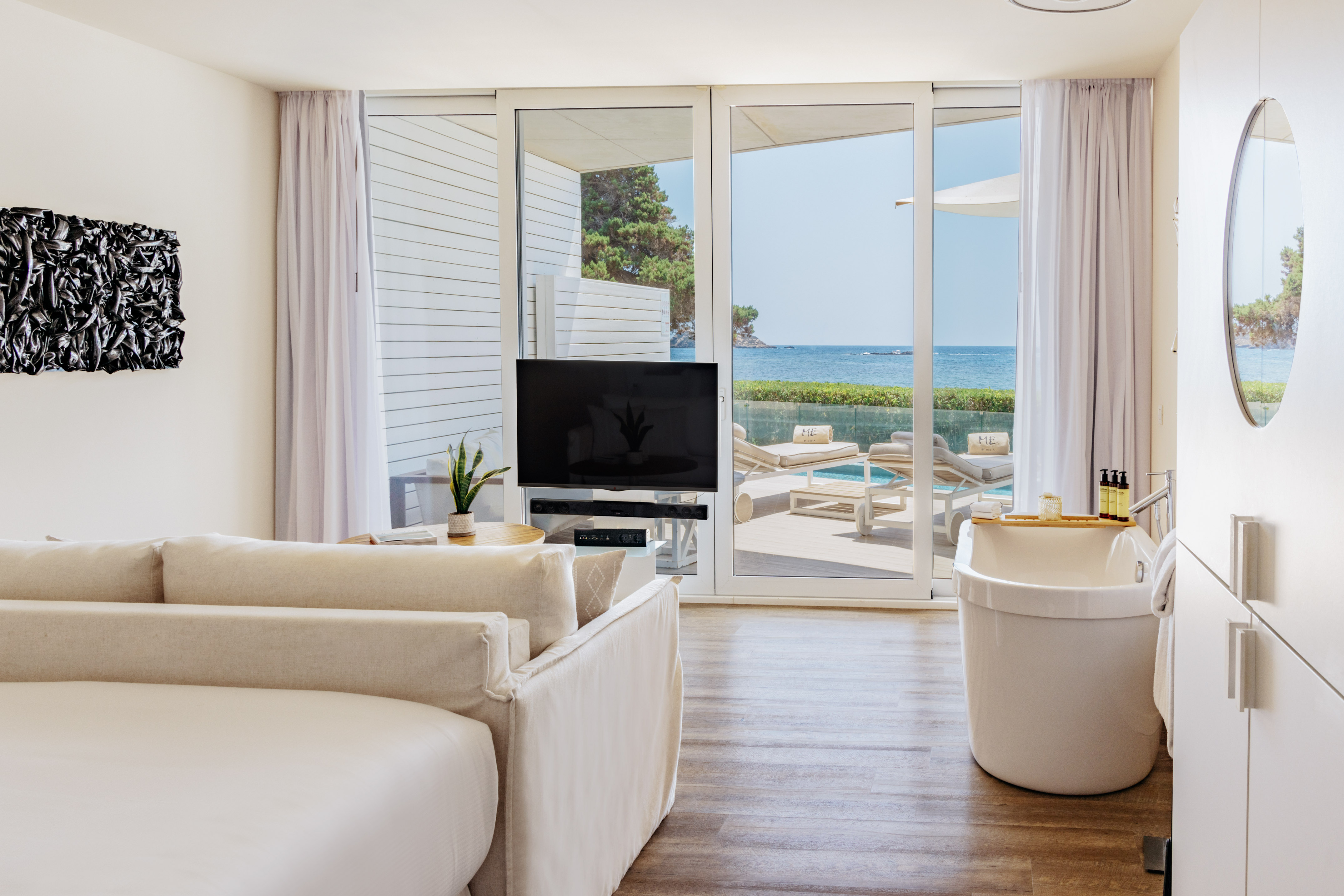 a room with a television and tub