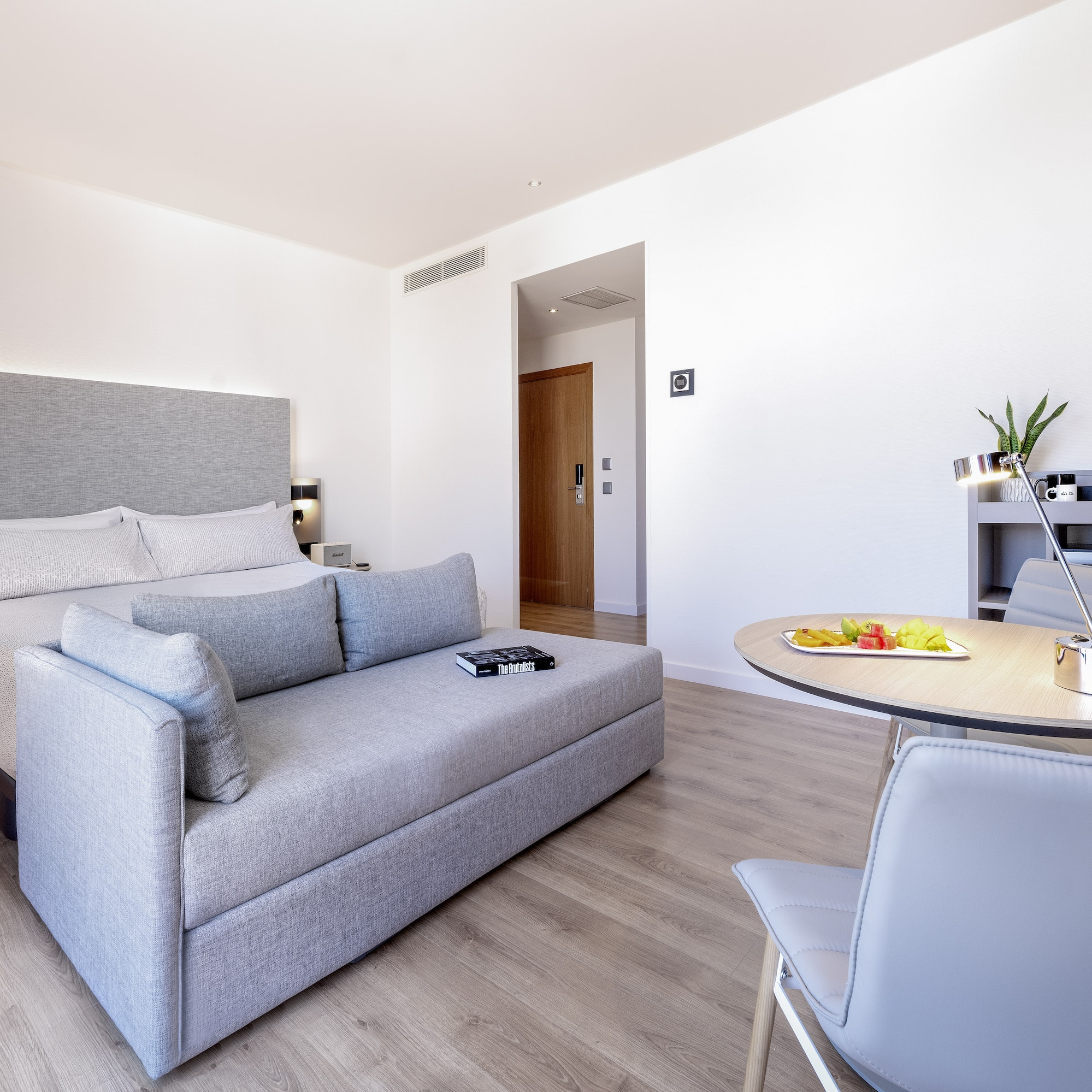 a room with a bed and a table