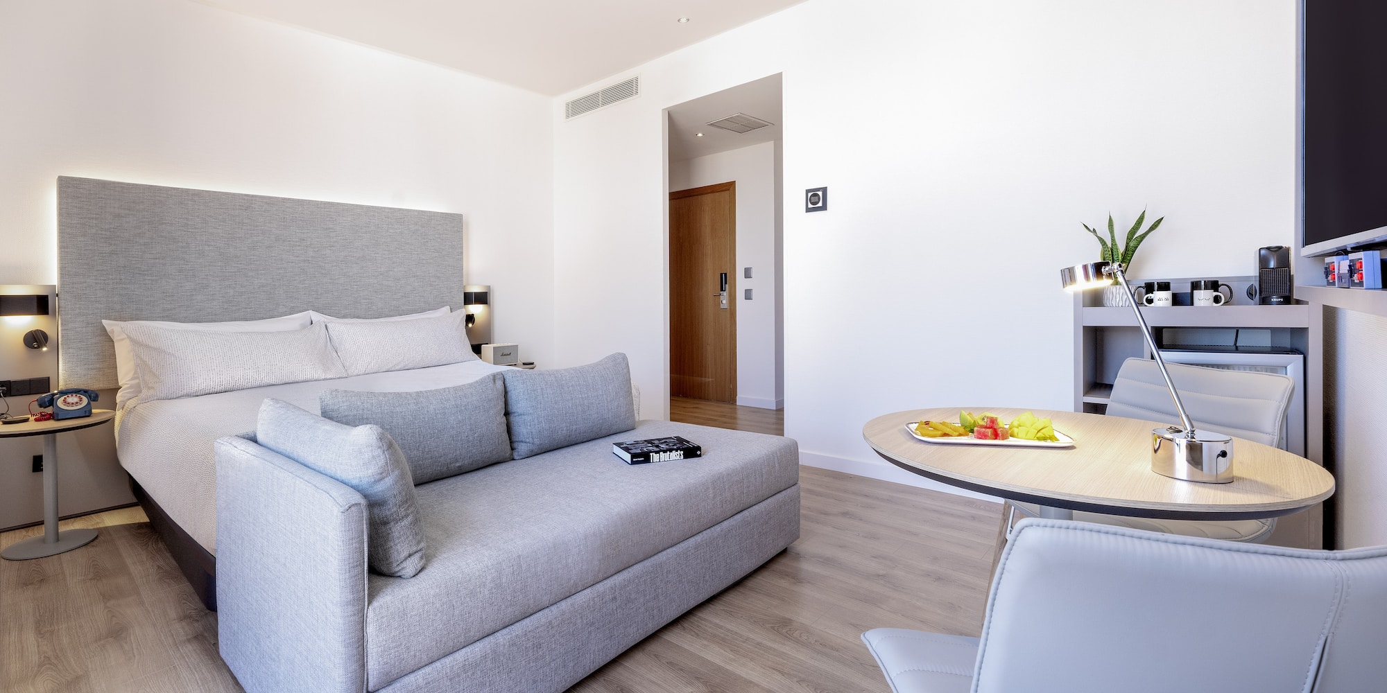 a room with a bed and a table