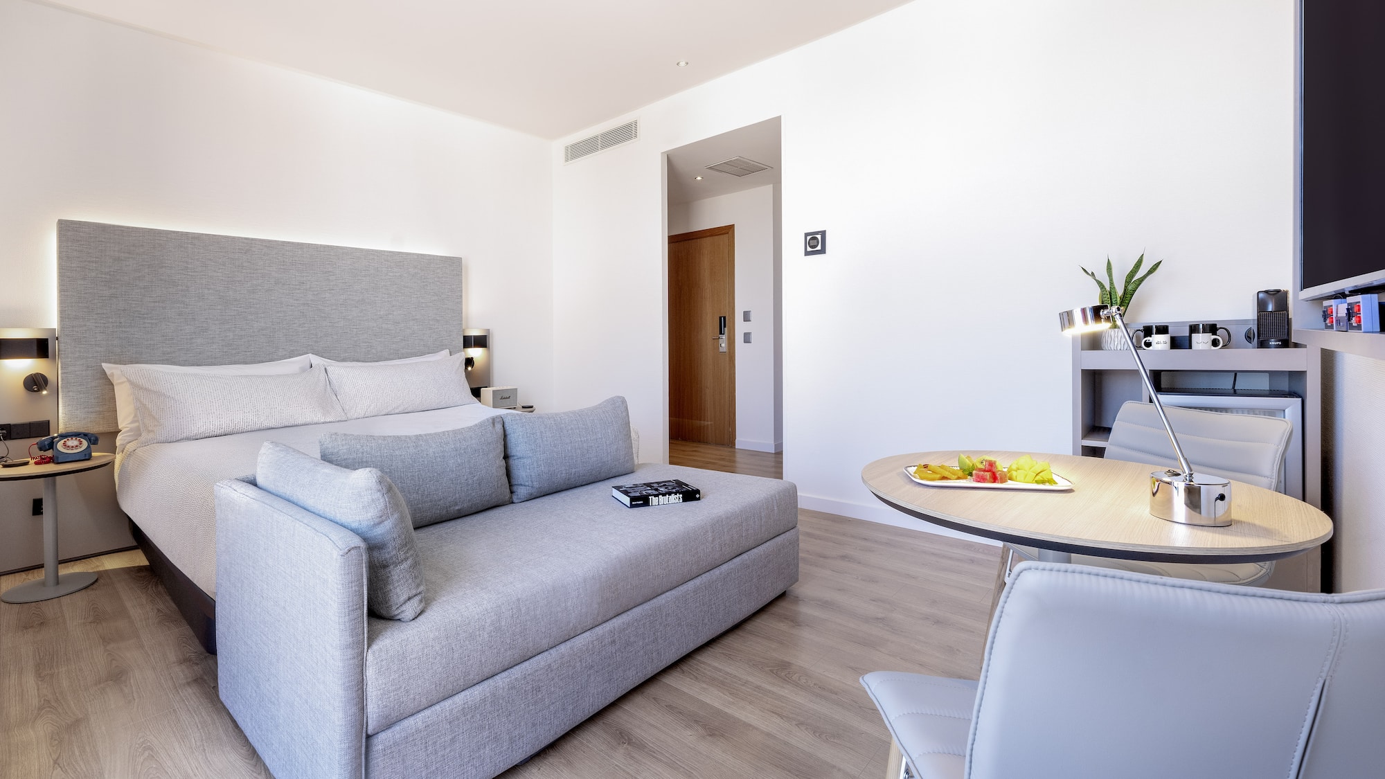 a room with a bed and a table