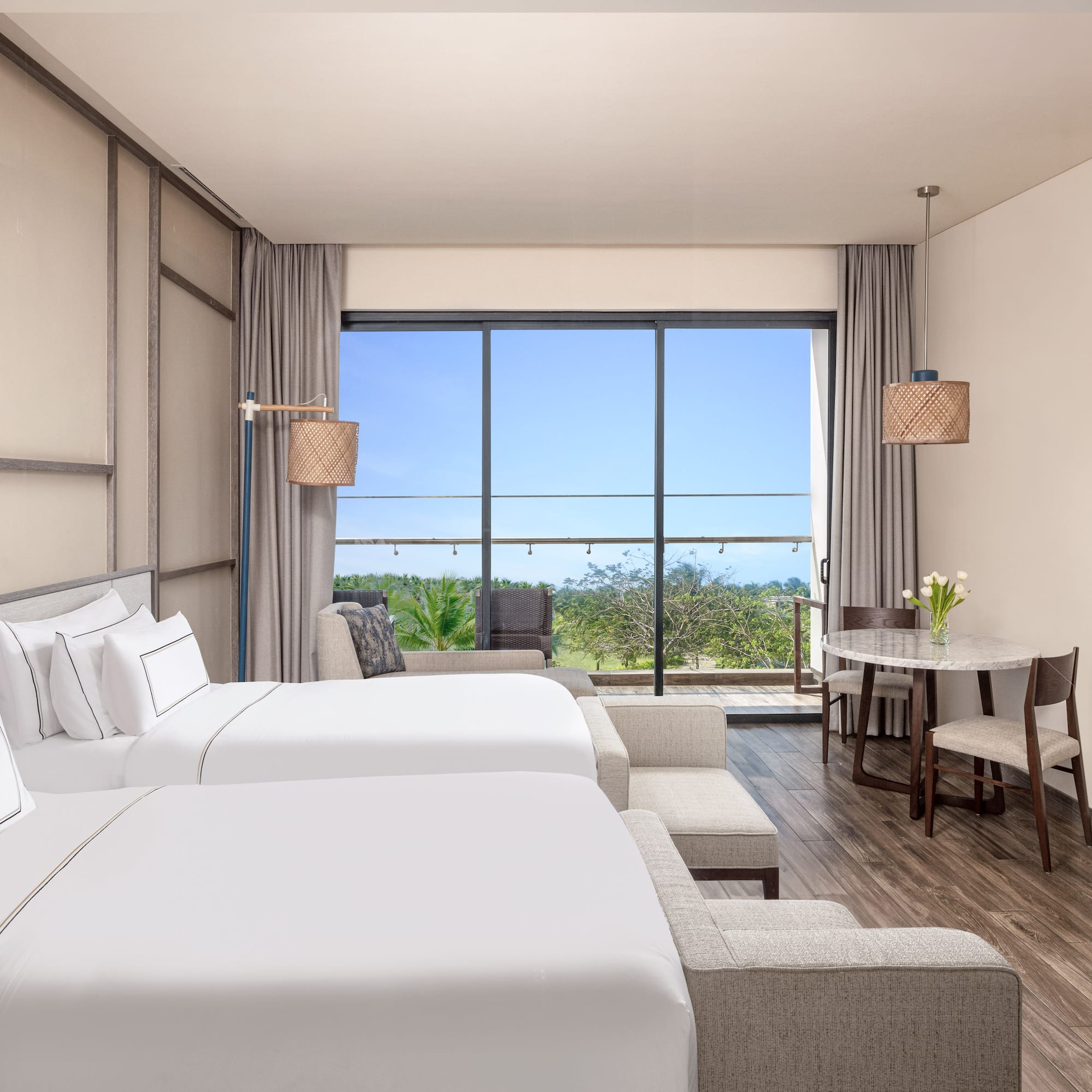 a room with two beds and a table