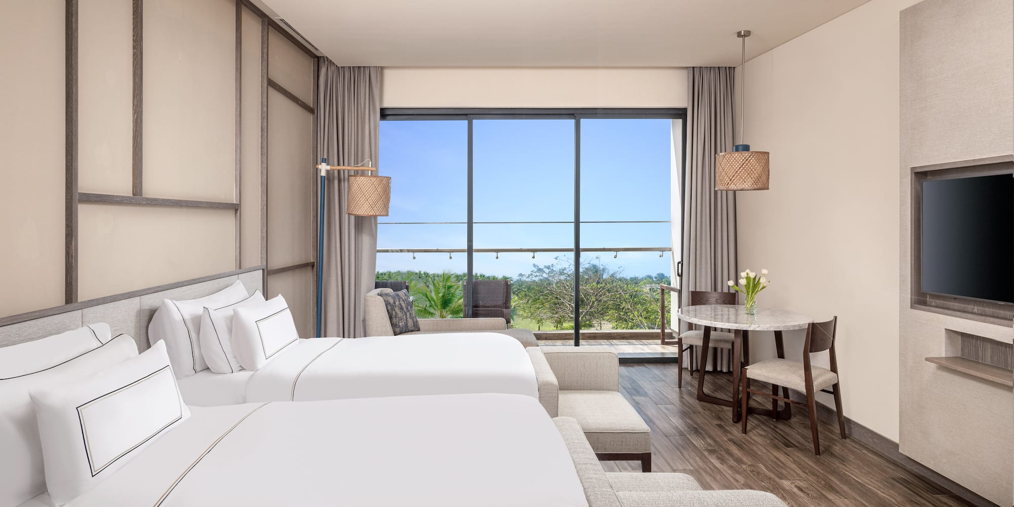 a room with two beds and a table