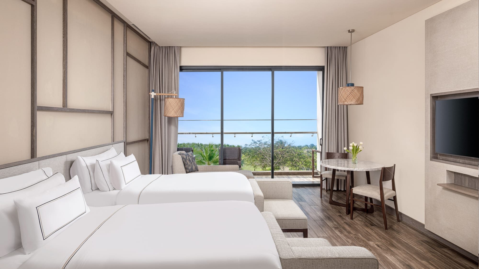 a room with two beds and a table