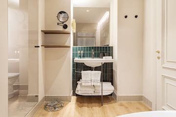 a bathroom with a sink and a mirror